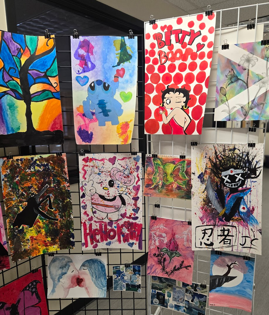 colorful student drawings hanging up