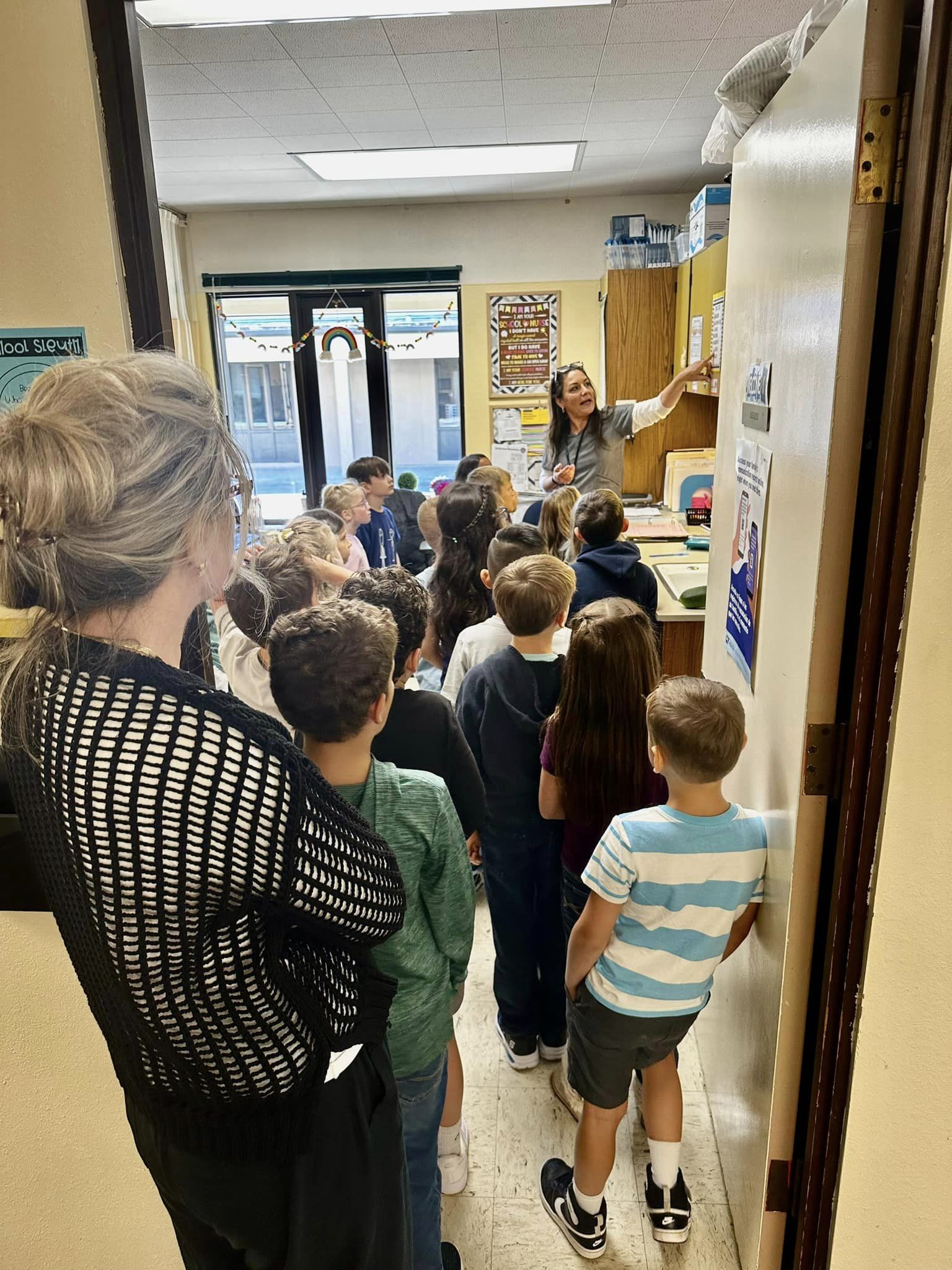 Students listening to a tour of their classroom