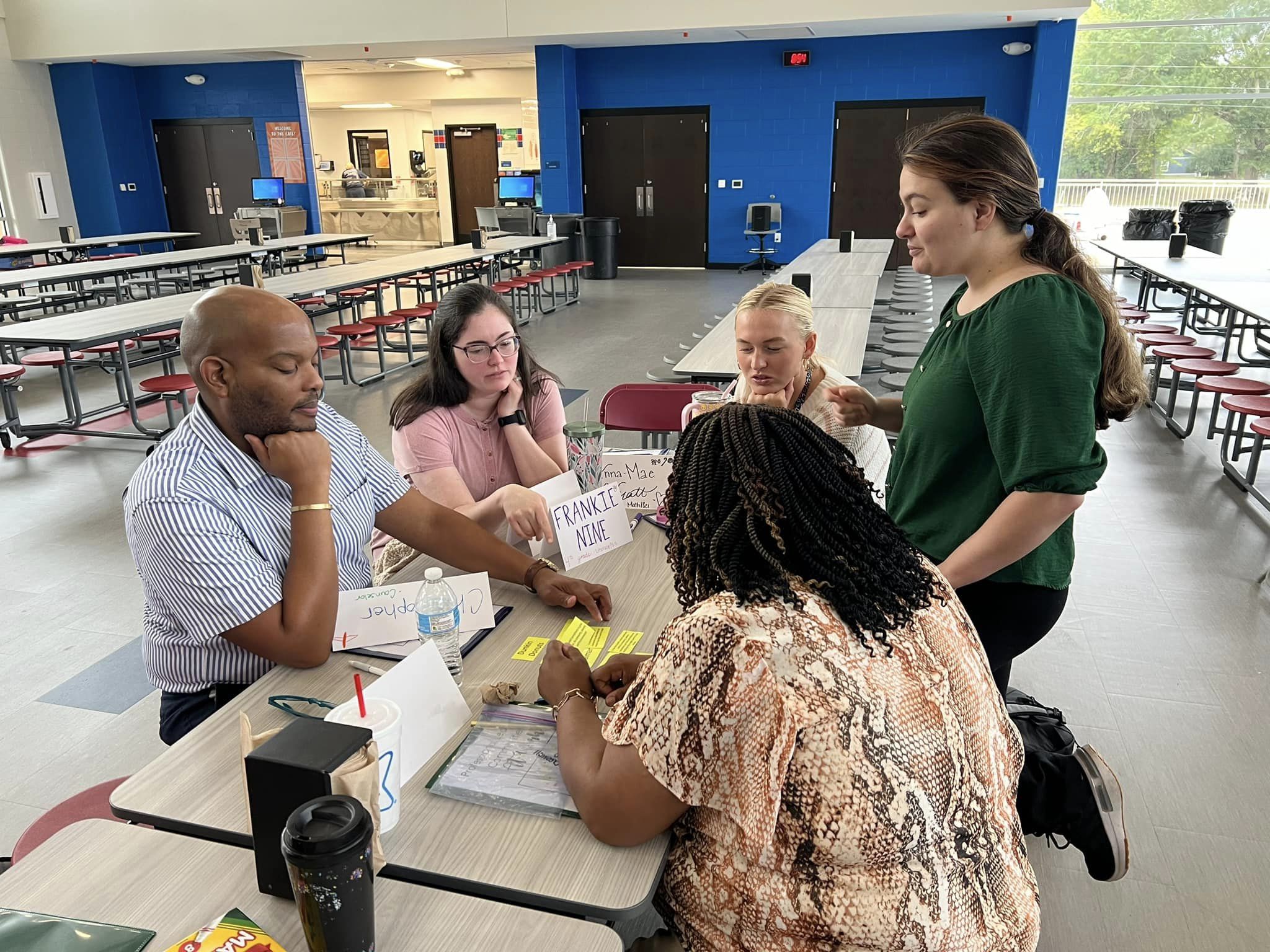 student holding the door open
