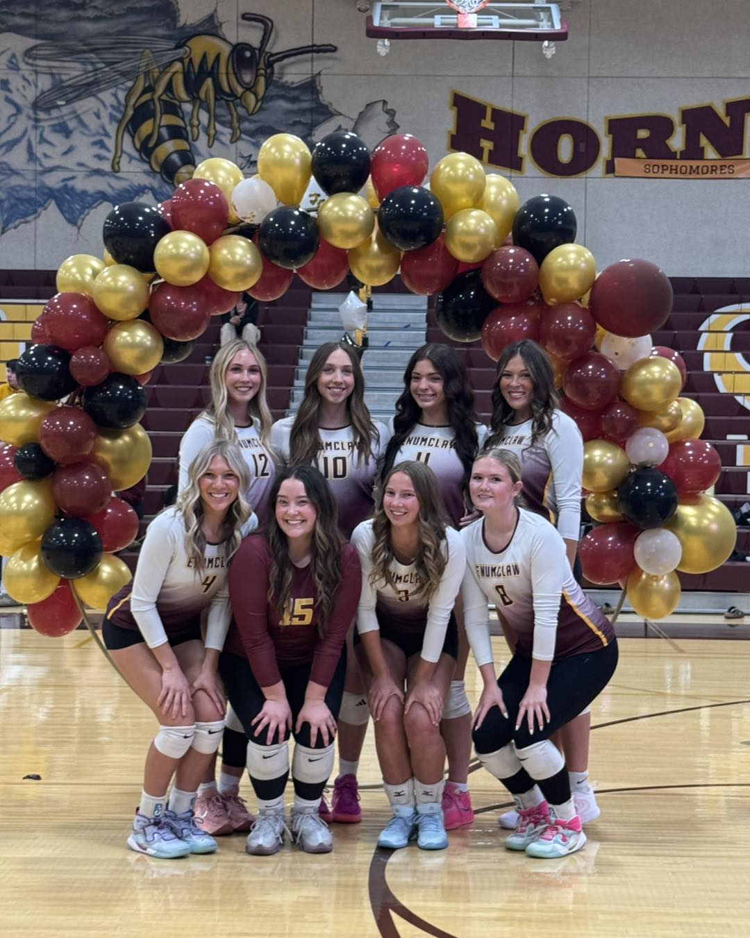 EHS girls volleyball team posing for group photo on senior night