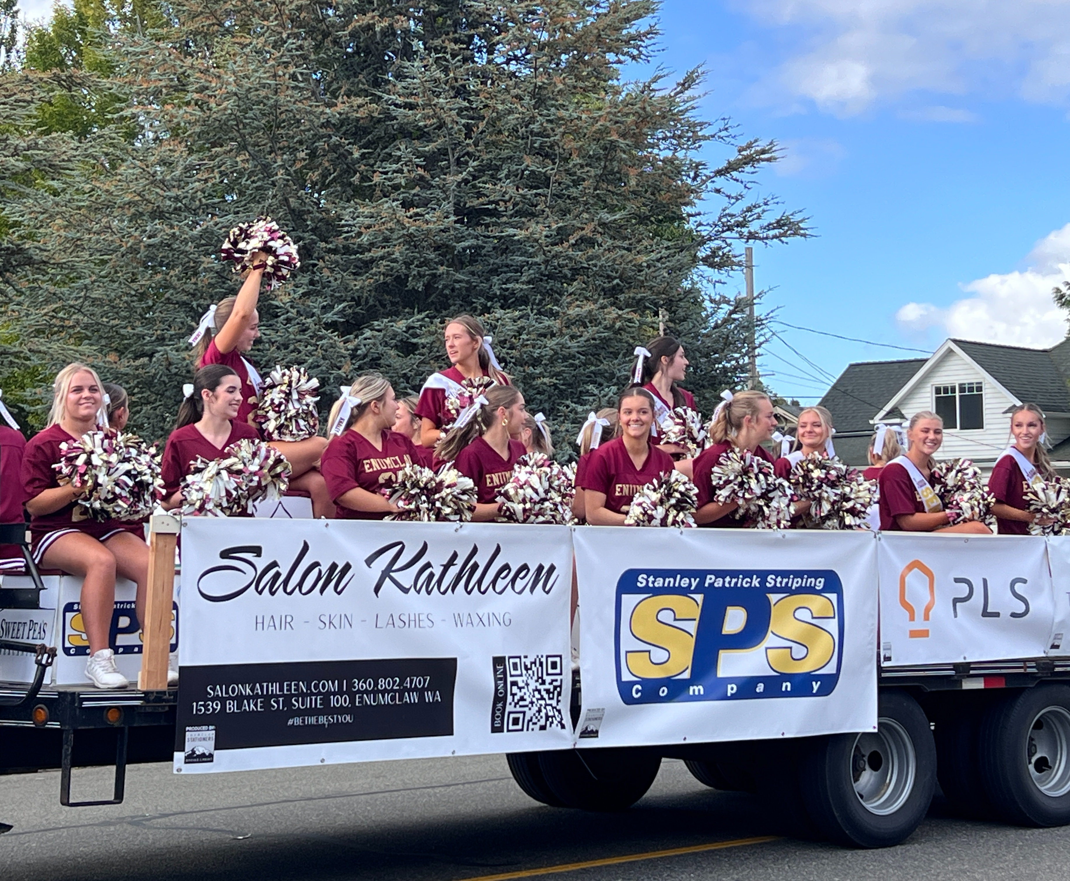 Cheer riding on float in parade