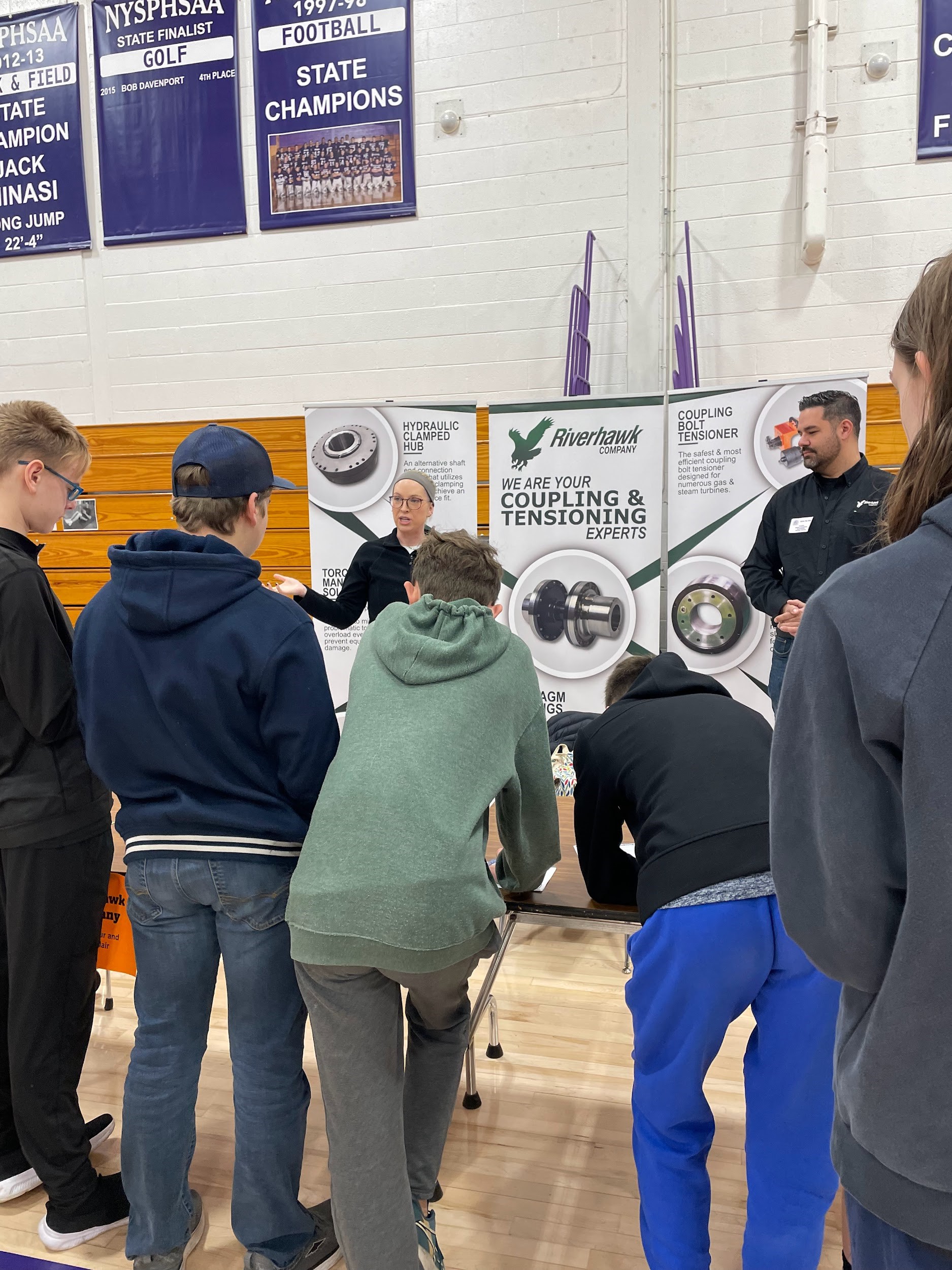Students visiting two presenters' table