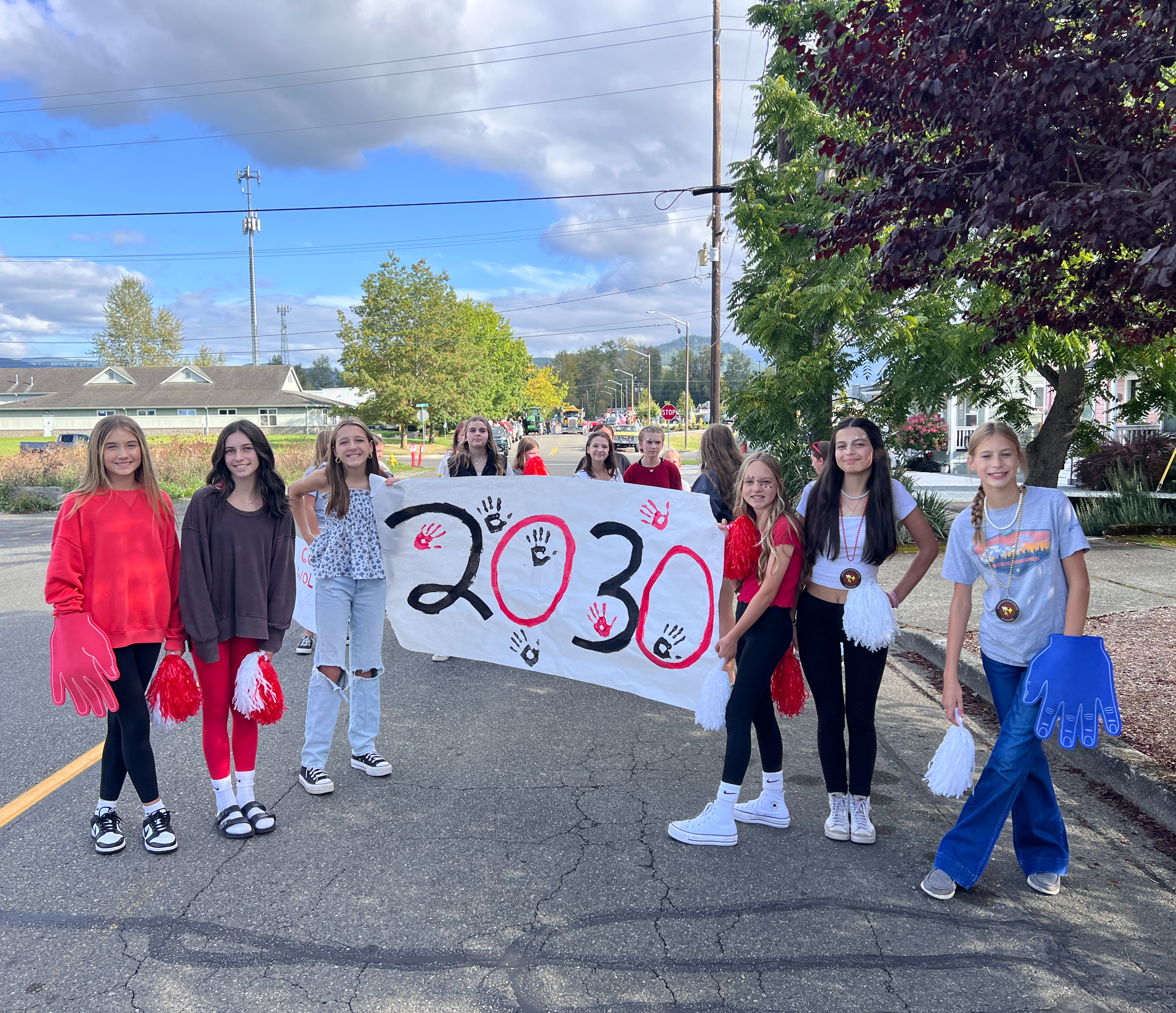 EMS Students holding 2023 banner getting ready to walk  parade