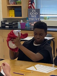 Ice Cream... it's in the bag!  No, seriously, the 6th-grade students at Goza Middle School made Ice Cream in a bag!  Mrs. Misty Smith, Goza's 6th-grade science teacher, partnered with Dr. Angela Douglass of OBU and her college students taking Natural Science for Elementary/ Middle School Teachers this week to explore this phenomenon.  Have you ever really thought about what you need to make ice cream? Some milk/ heavy cream, sugar, vanilla flavoring, ice cubes, baggies, and then of course, don't forget the salt! YES, salt! That is the game changer. Salt lowers the freezing point of ice. During the experiment, students discovered that HEAT was being transferred during the bag shaking. HEAT was transferred from the liquid cream mixture to the ice, which caused the ice to melt and the cream to get colder. The more you shake, the more the cream changes into ice cream.  The 6th graders definitely had to work for that dessert, and they all agree... science has never tasted so GOOD!