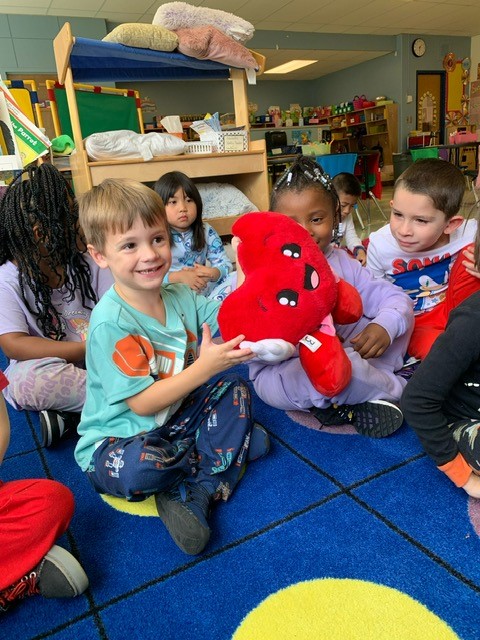 Mr. Heartly visits Mrs. Sloan's class.