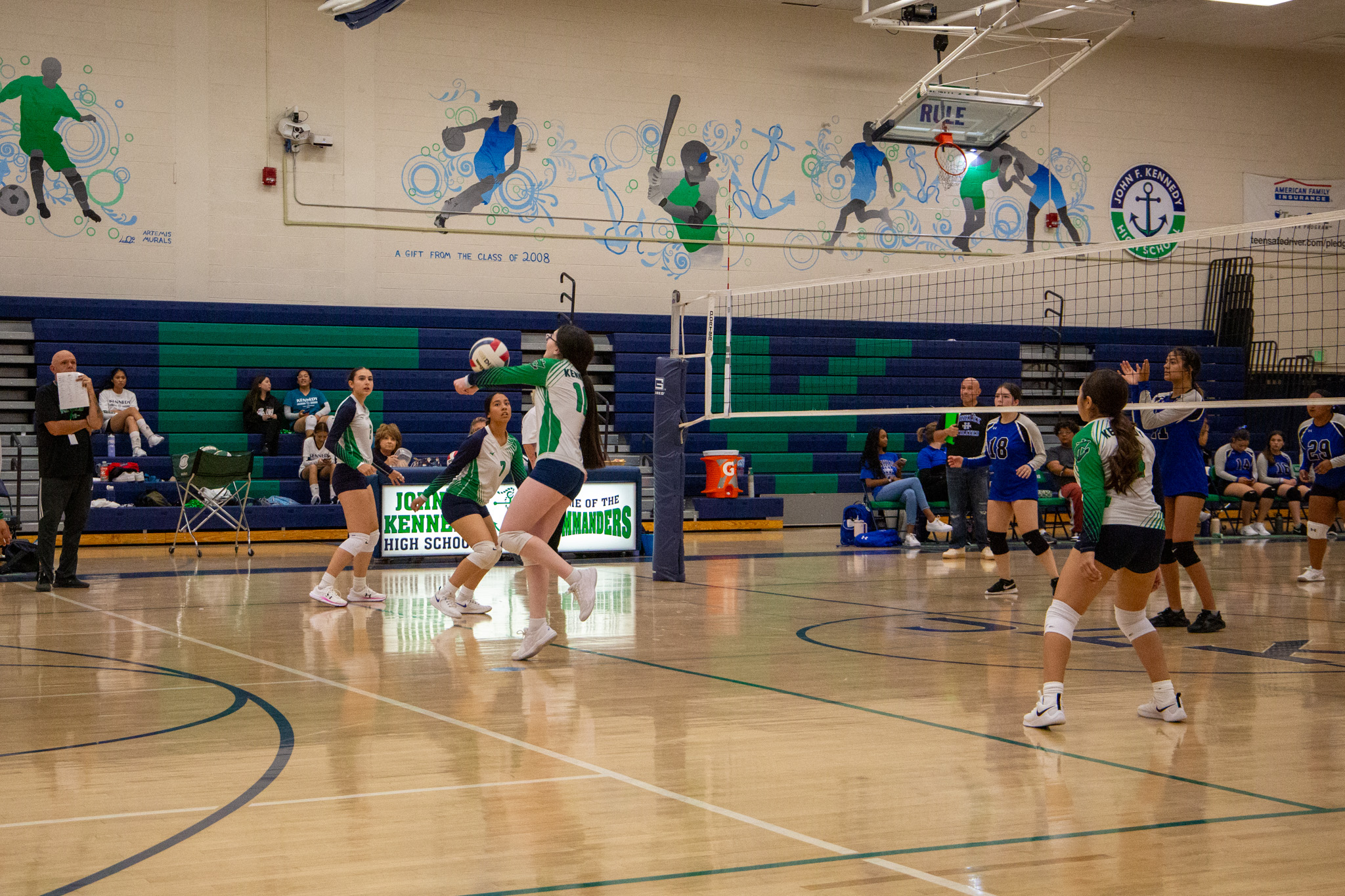 Pictured: a member of the JV volleyball team bumps the ball. 