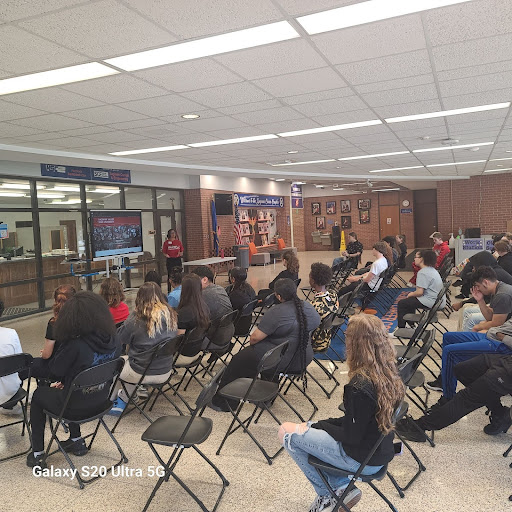 students sitting on chairs with a guest speaker from SVSU at the front of the class 