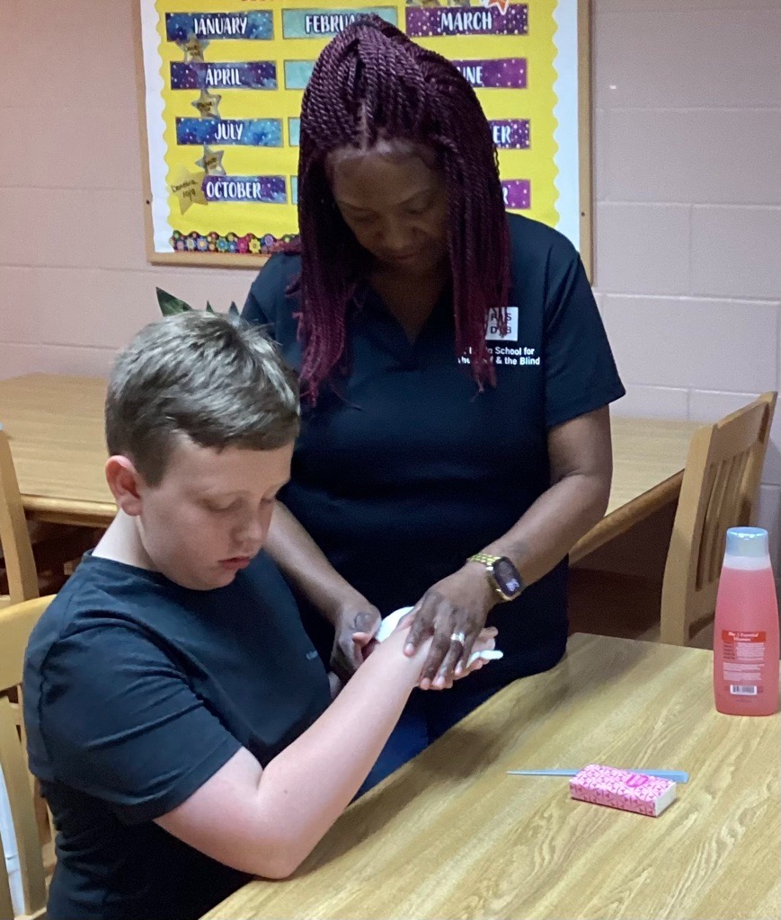 Kessler learns about hygiene from Ms. LaRonda.