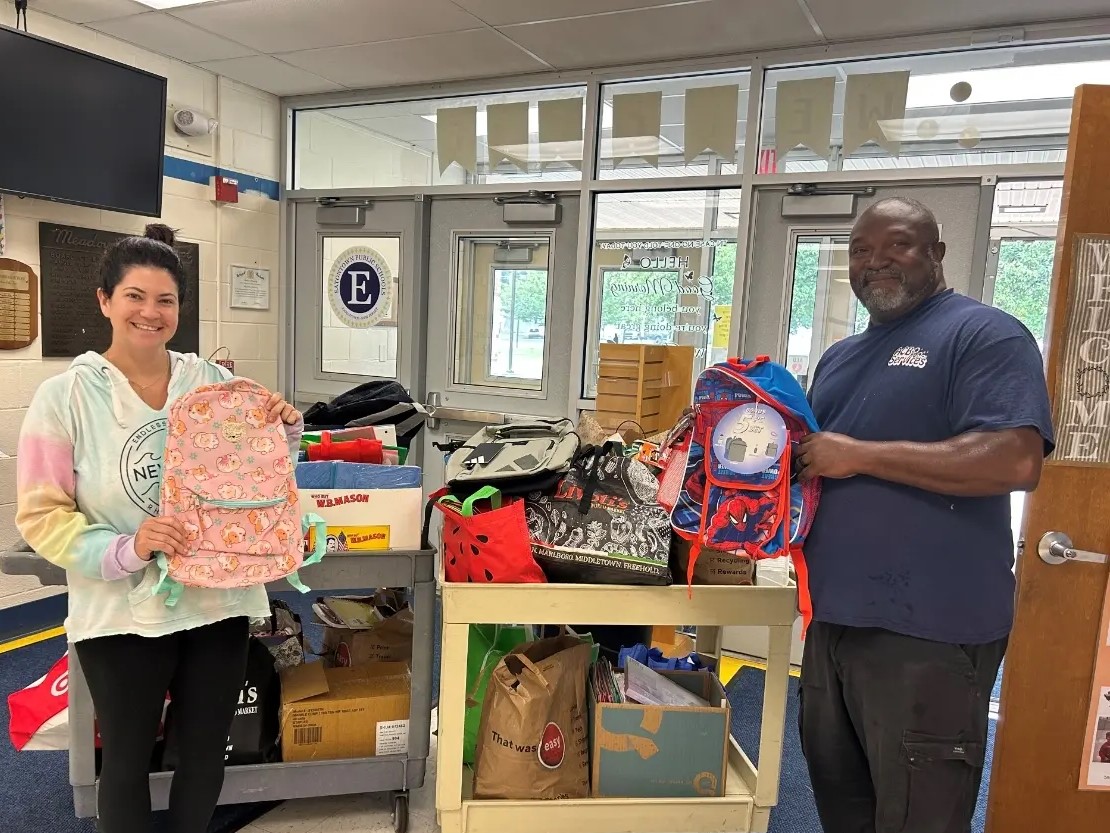 Ms. Hall and Mr. James with donations from IMA Urgent Care