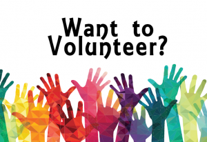 Want to volunteer? with lots of hands raised in the air.