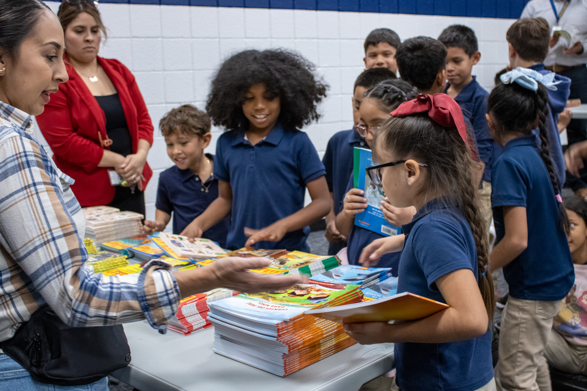 Students pick out three free books in the auditorium last week.  