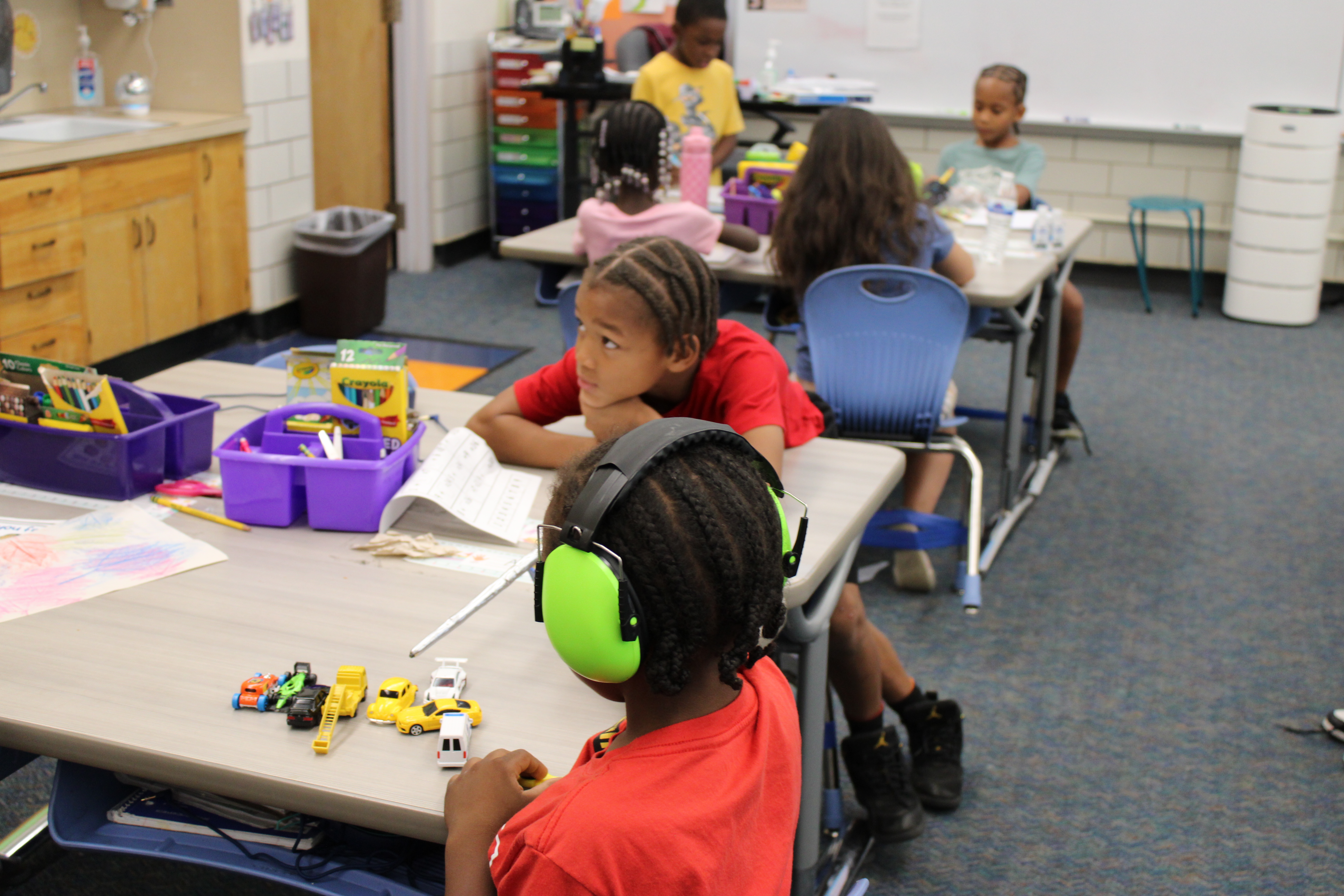 Students coloring in a classroom