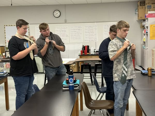 Students practicing a neck tie