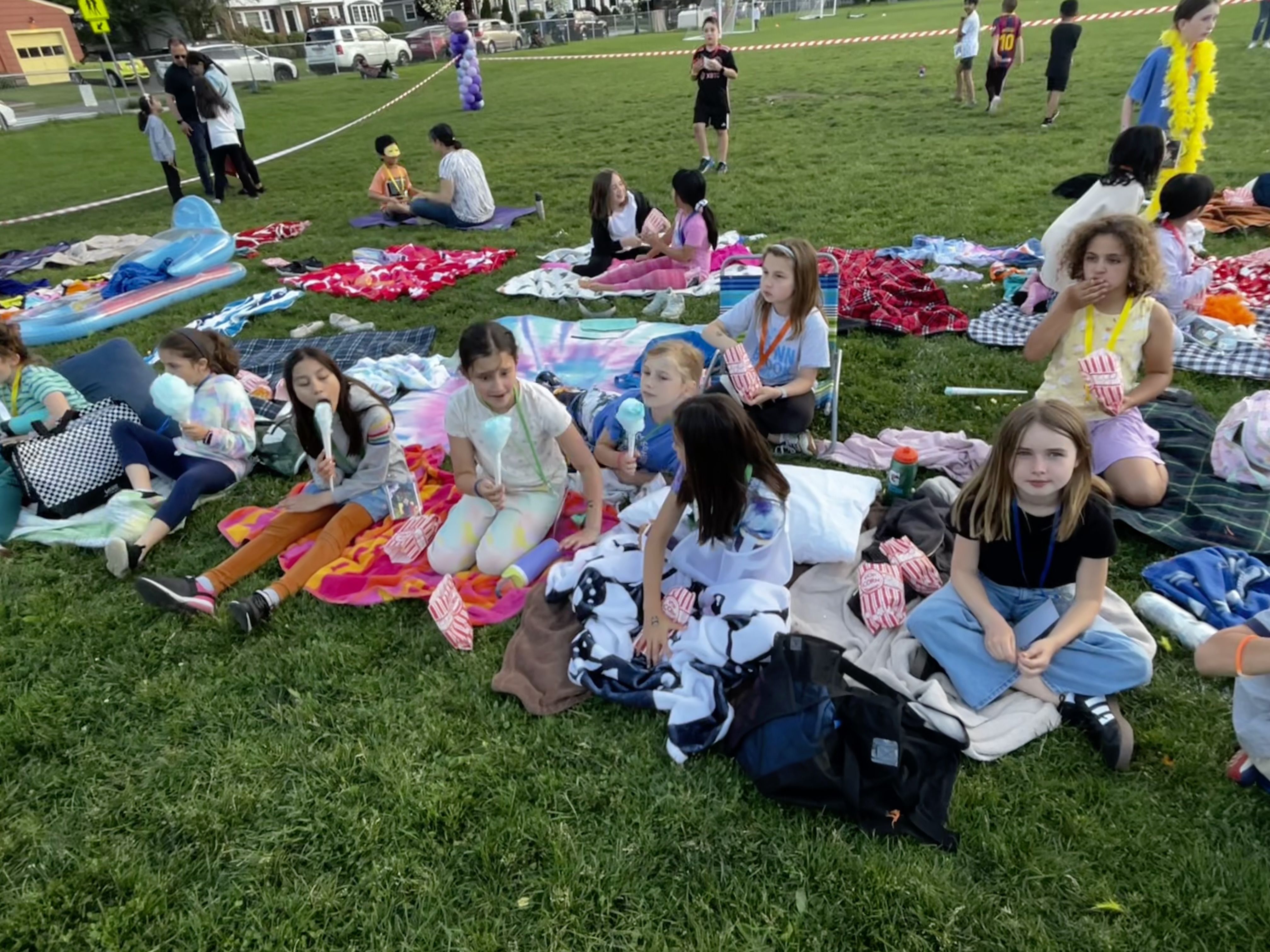 picnicking kids before movie night outside