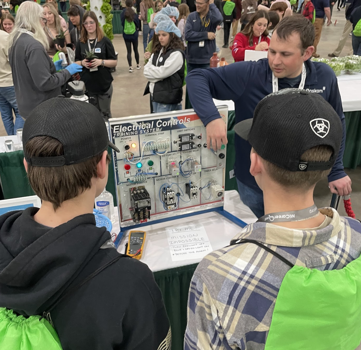Students viewing an electricity  display