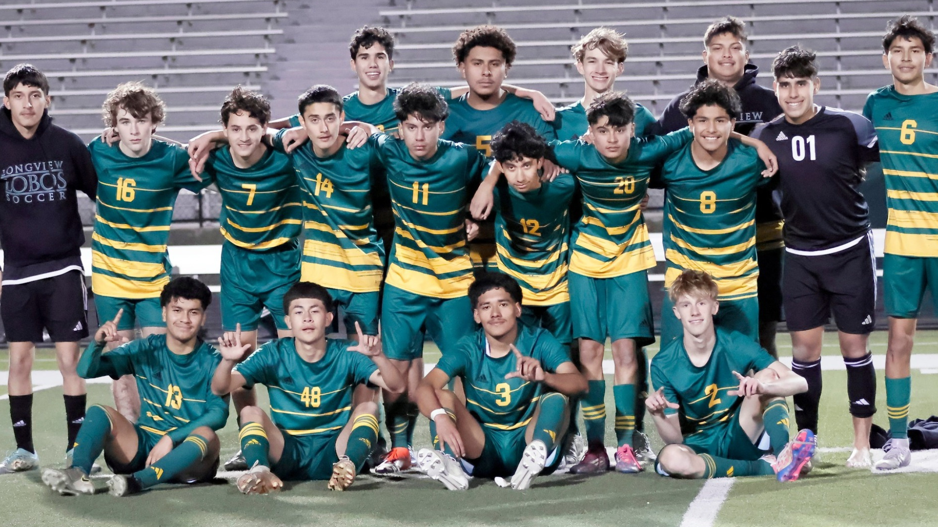 Longview Lobo boys soccer pose for a photo after a win against Forney.