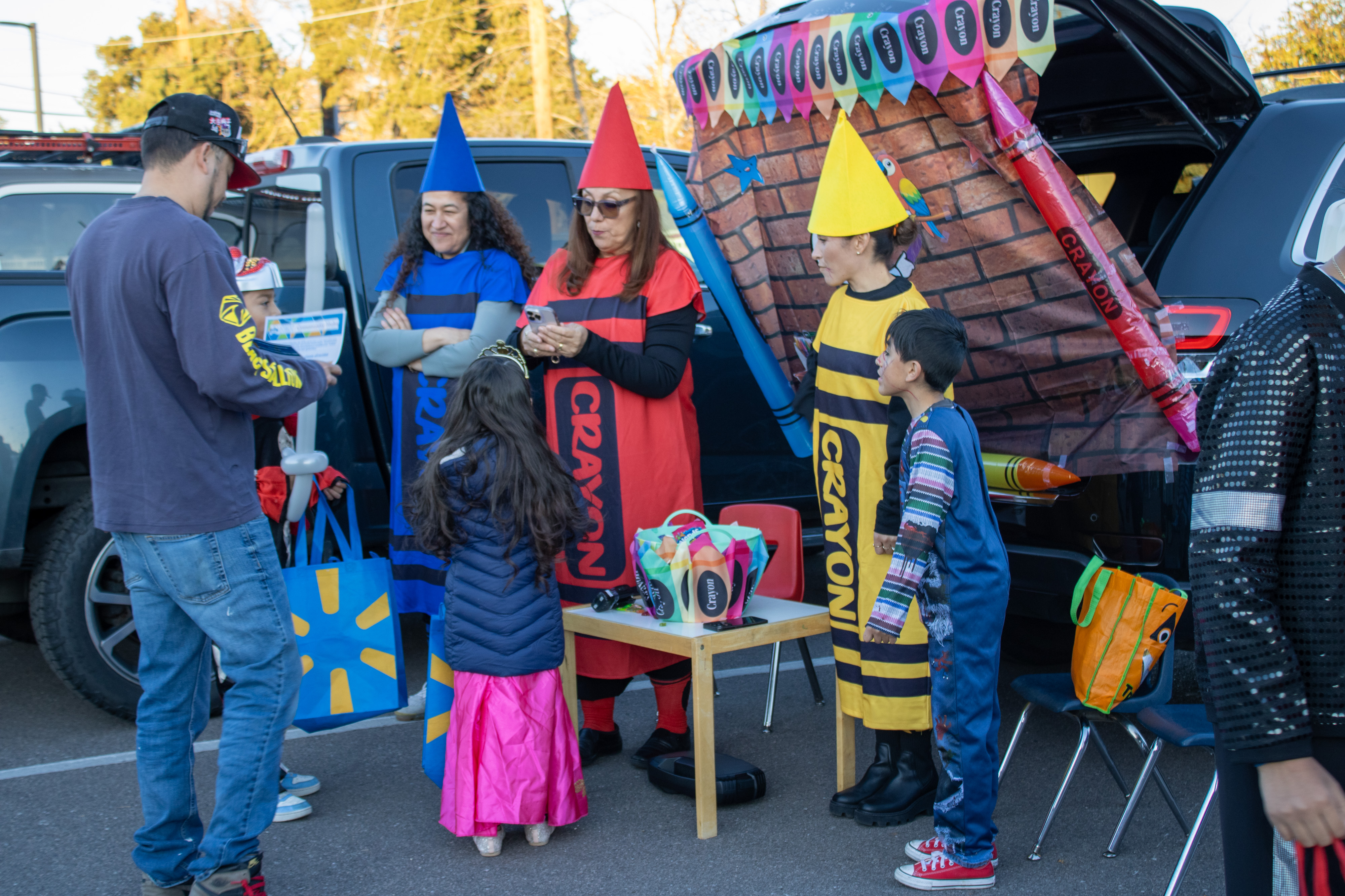 Teachers dress as crayons at Trunk or Treat.