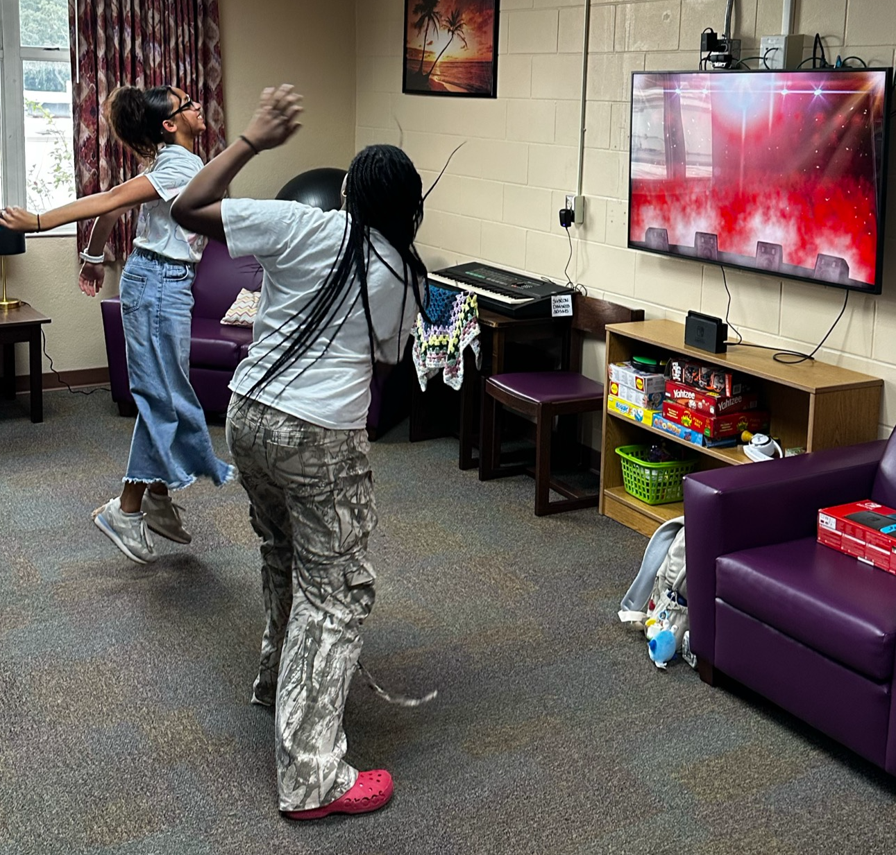 Jesa and Shanteria dancing while playing Nintendo