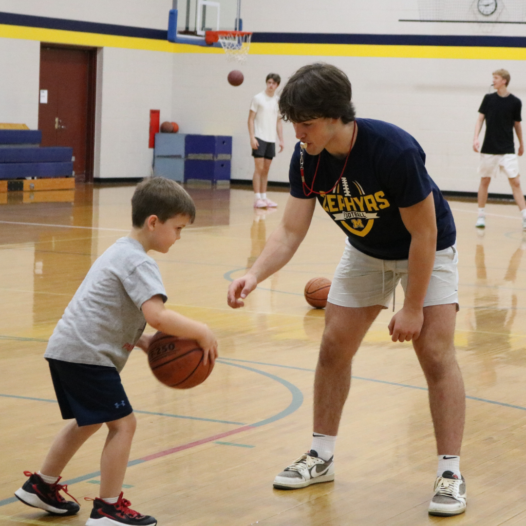 Students playing basketball