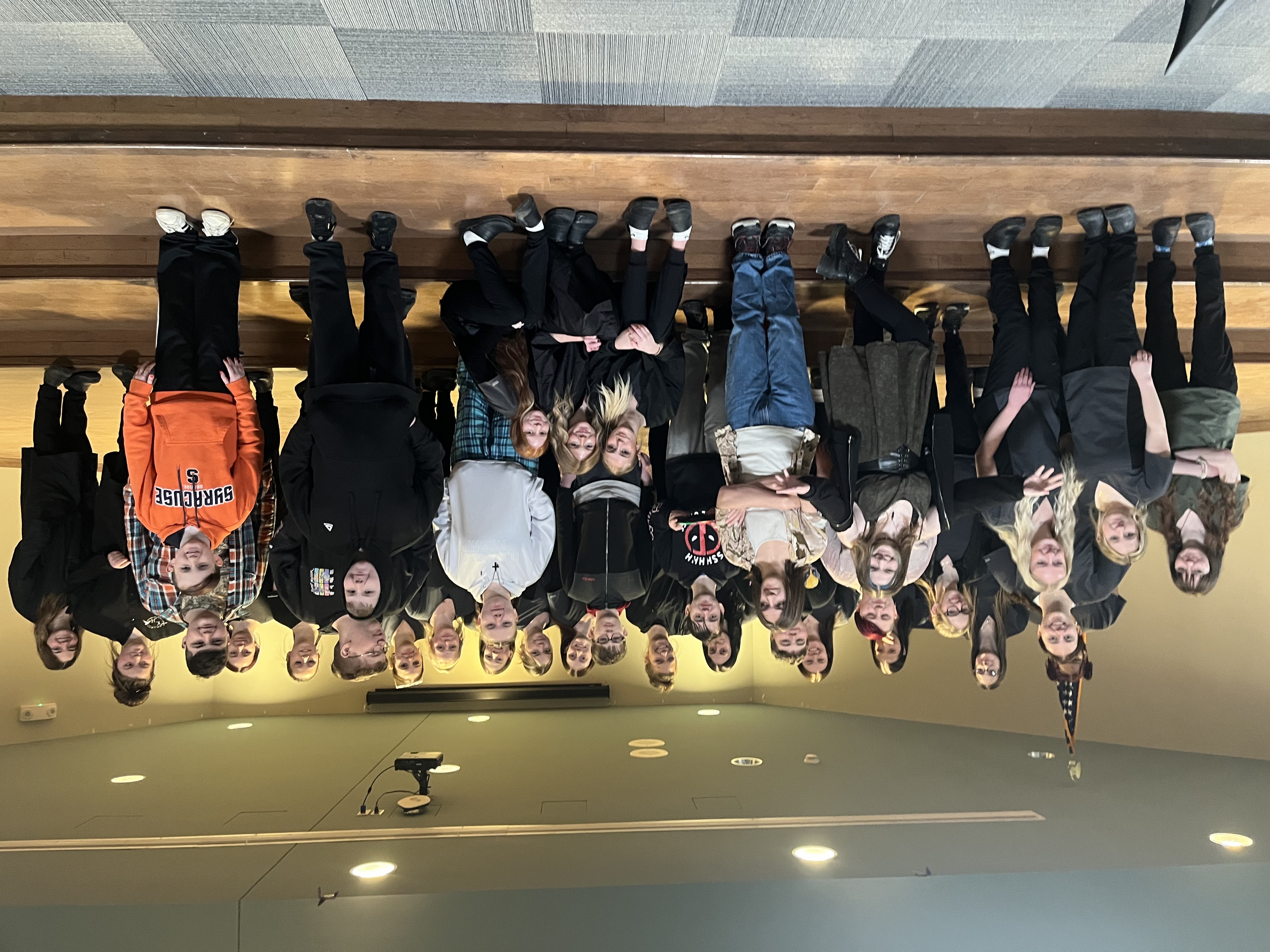 Pathways students and Cosmetology studnents posing on stage in WEB Complex lobby