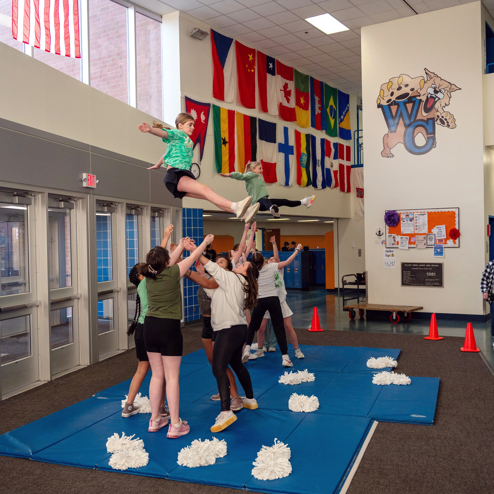 students practicing a cheer routine