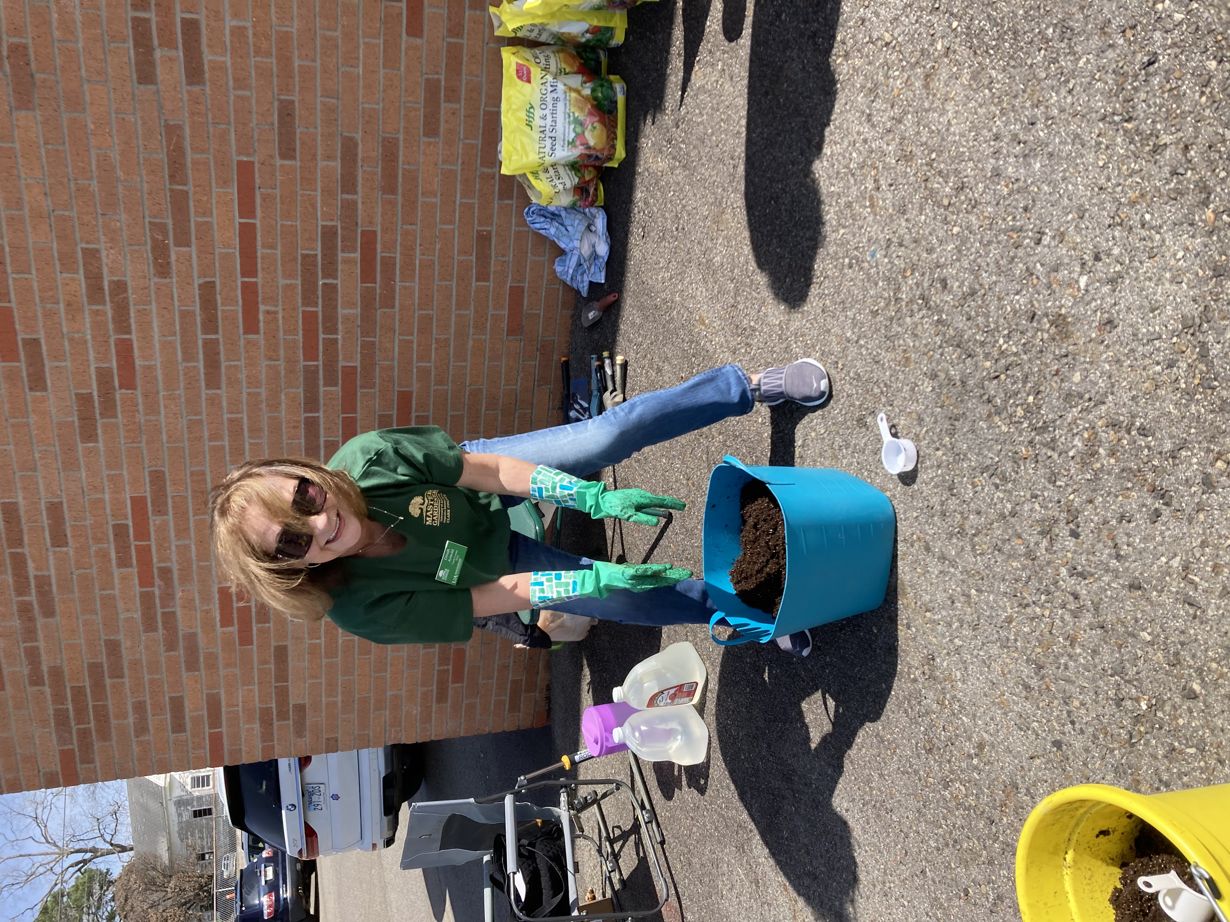 Master gardener mixing soil