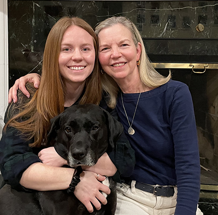 Ms. McAndrew and and her daughter, with a dog.