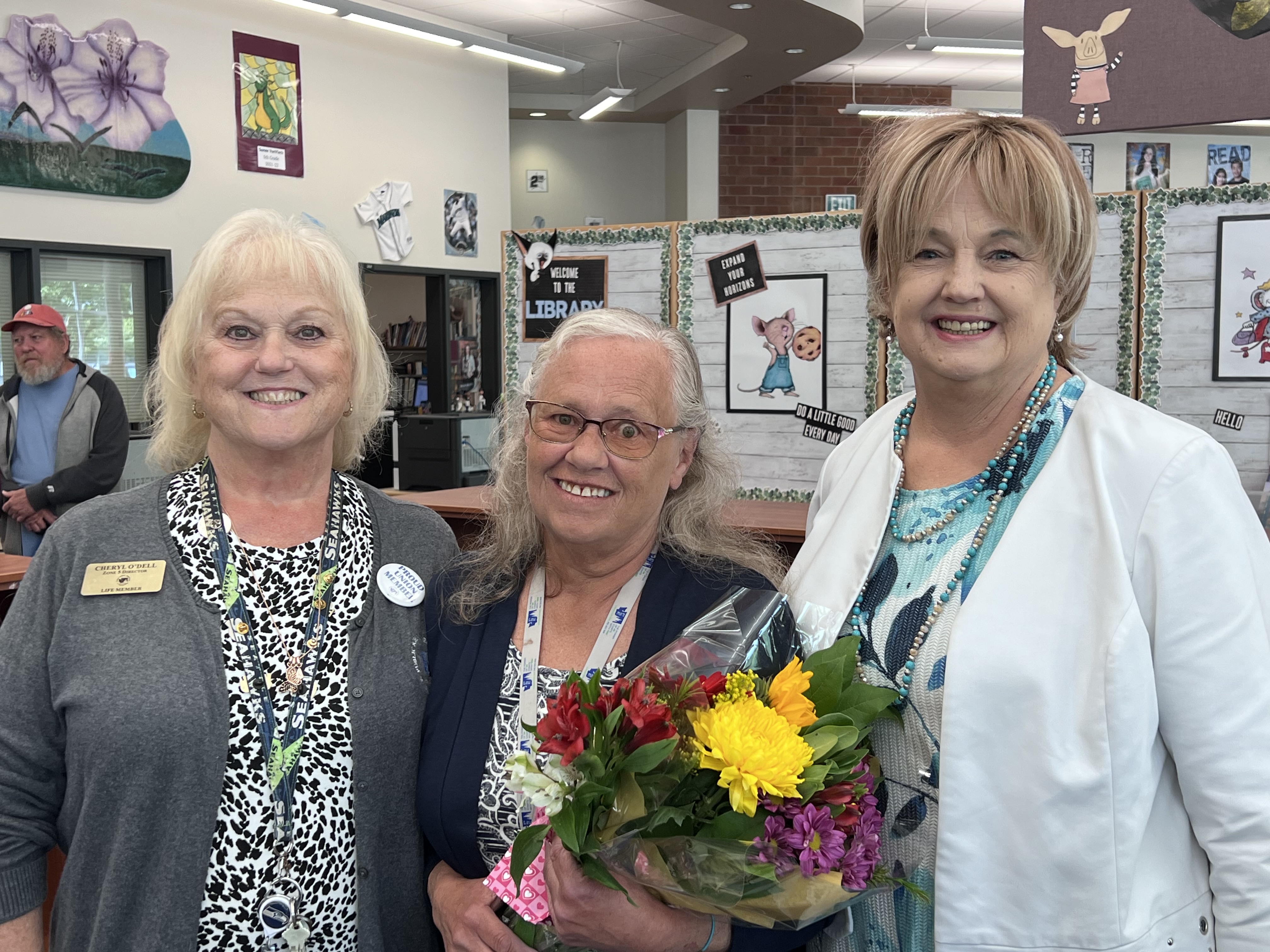 Lori Benson (center) with two other people