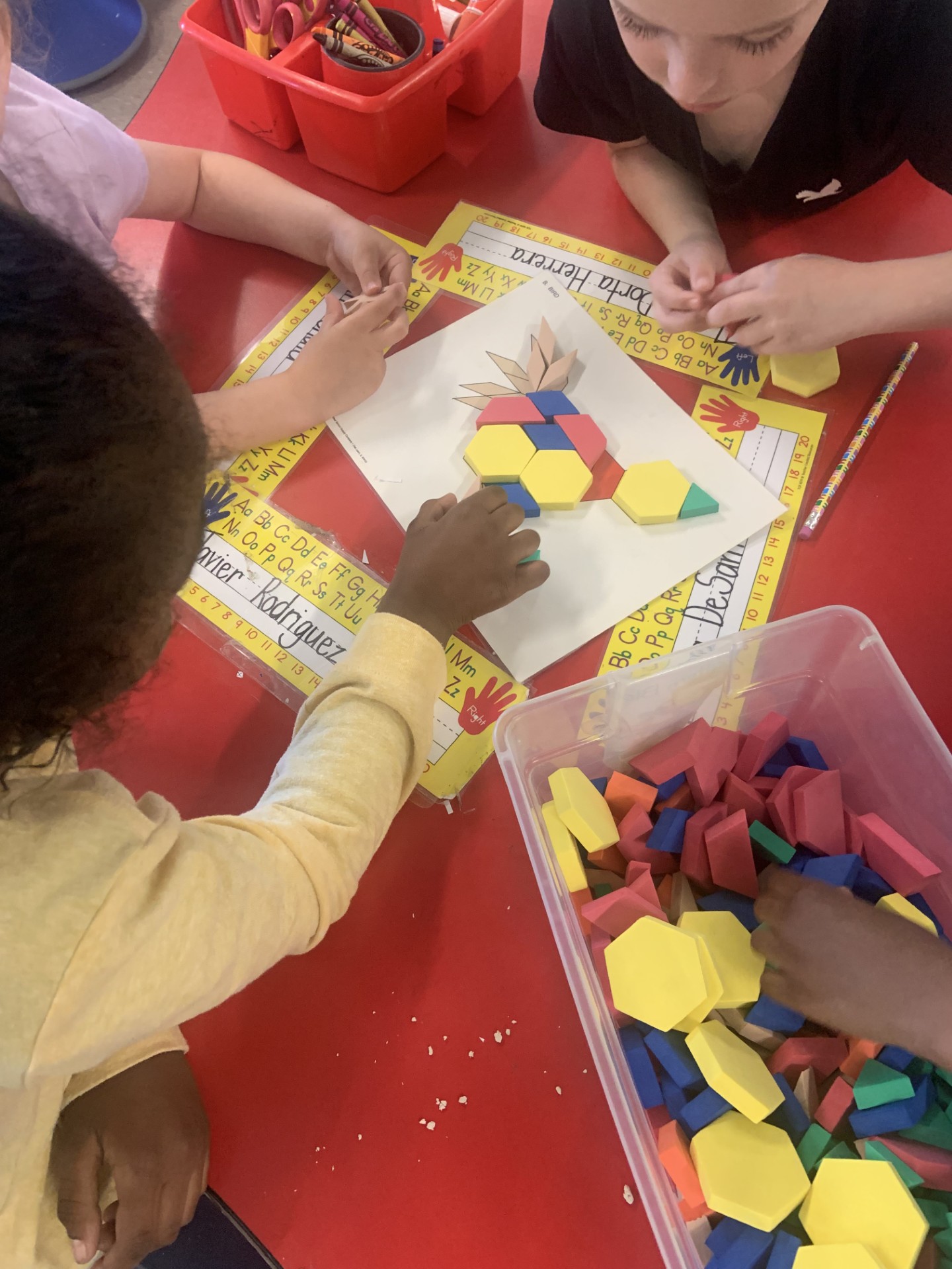 Kids playing with tangrams