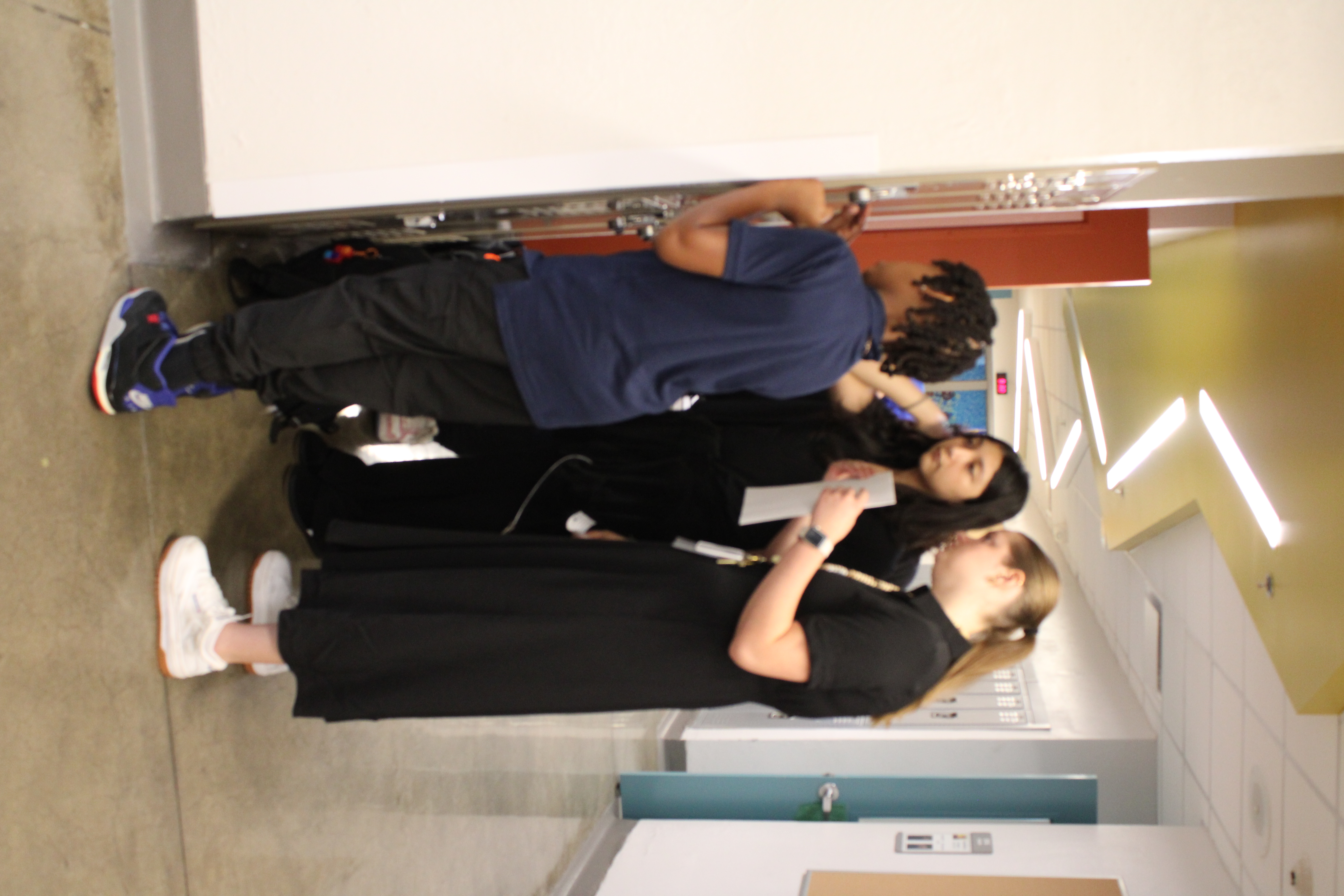 Teacher helping with lockers