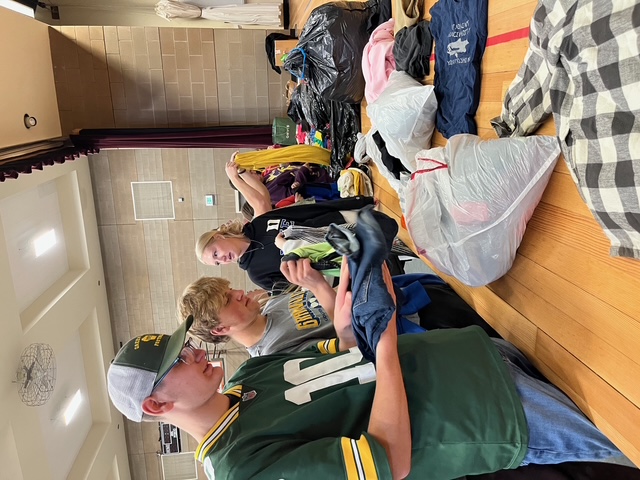 seniors helping set up the clothing giveaway