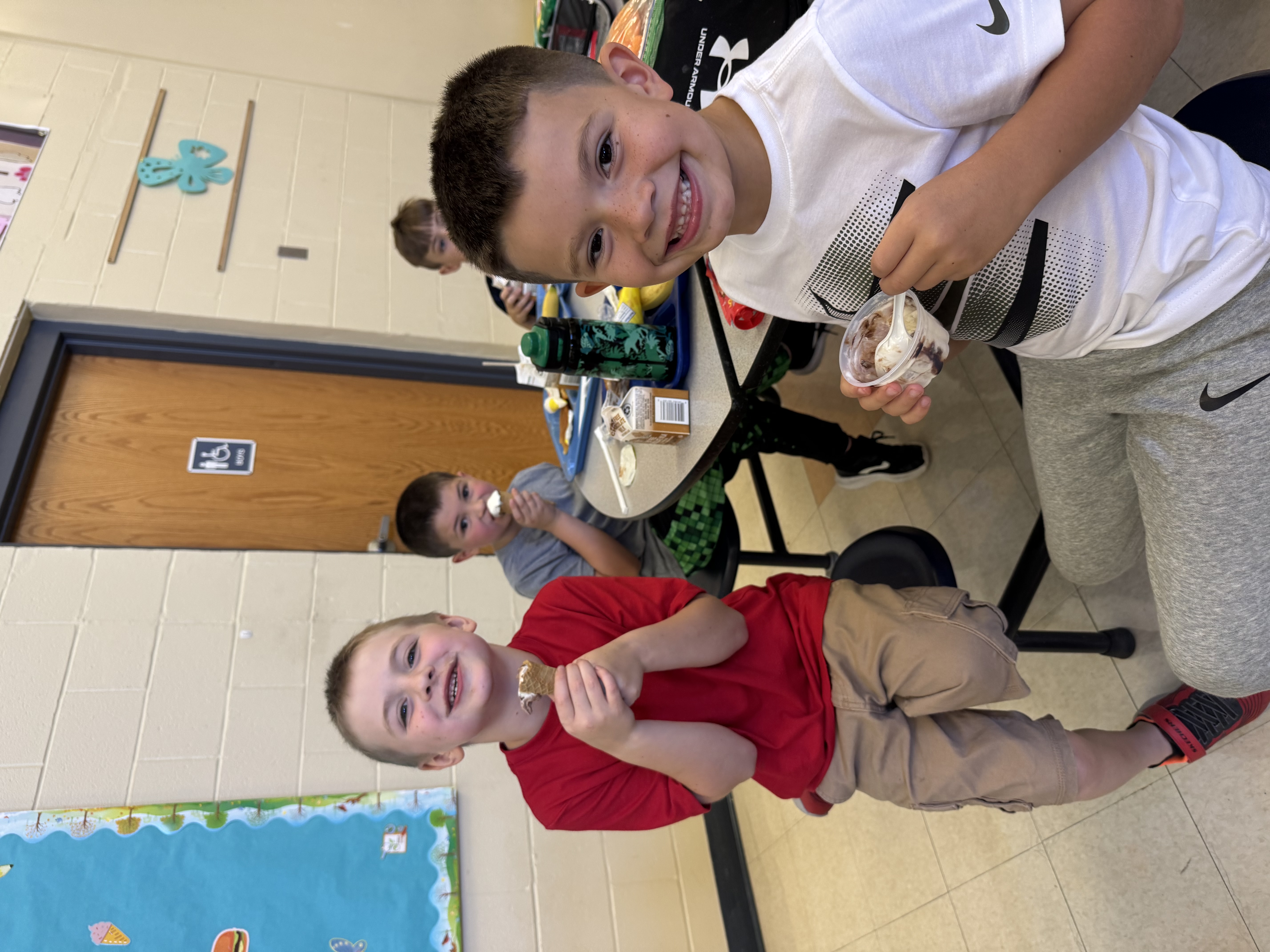 a picture of boys eating ice cream treat at MJT