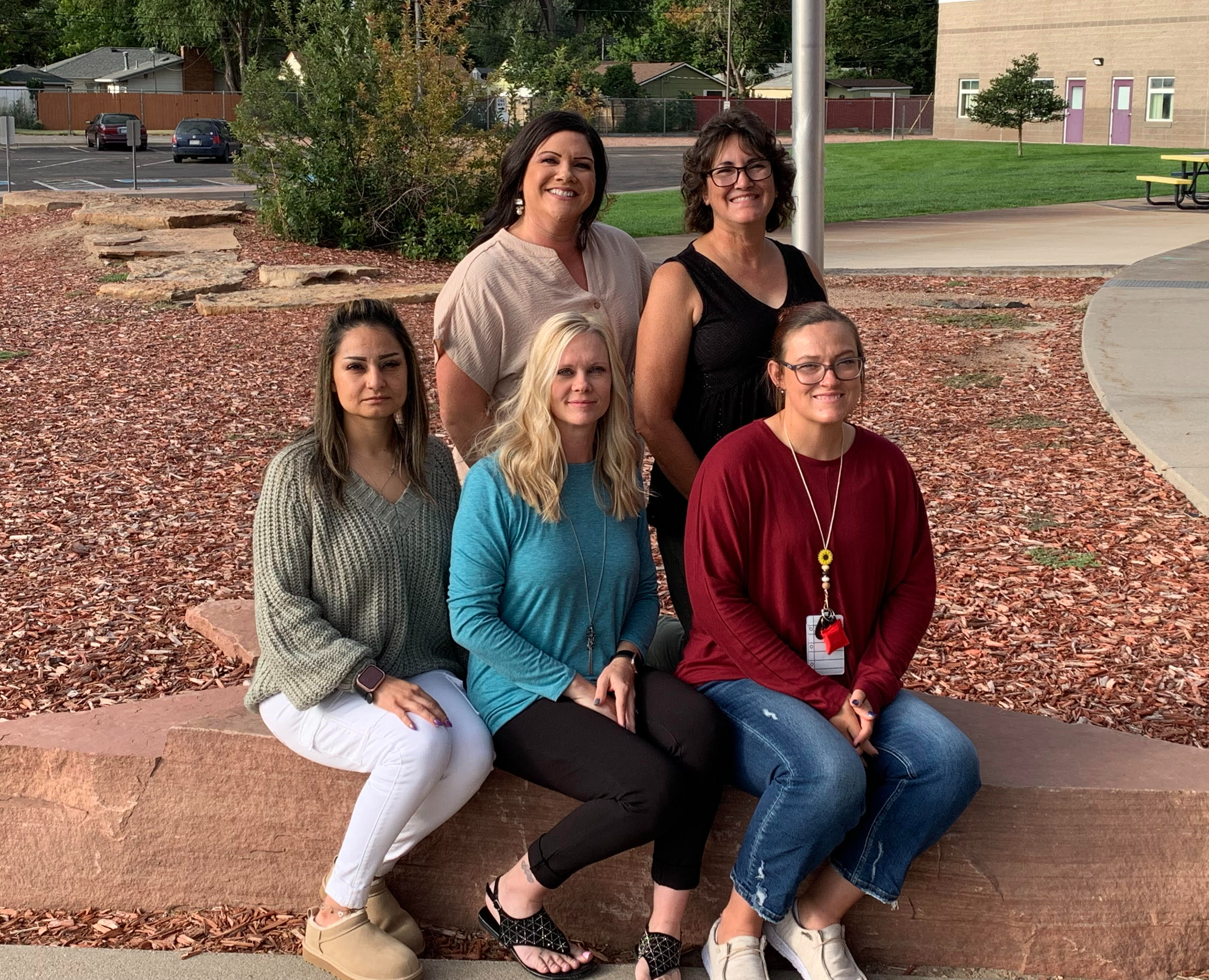 Office Staff members in front of school