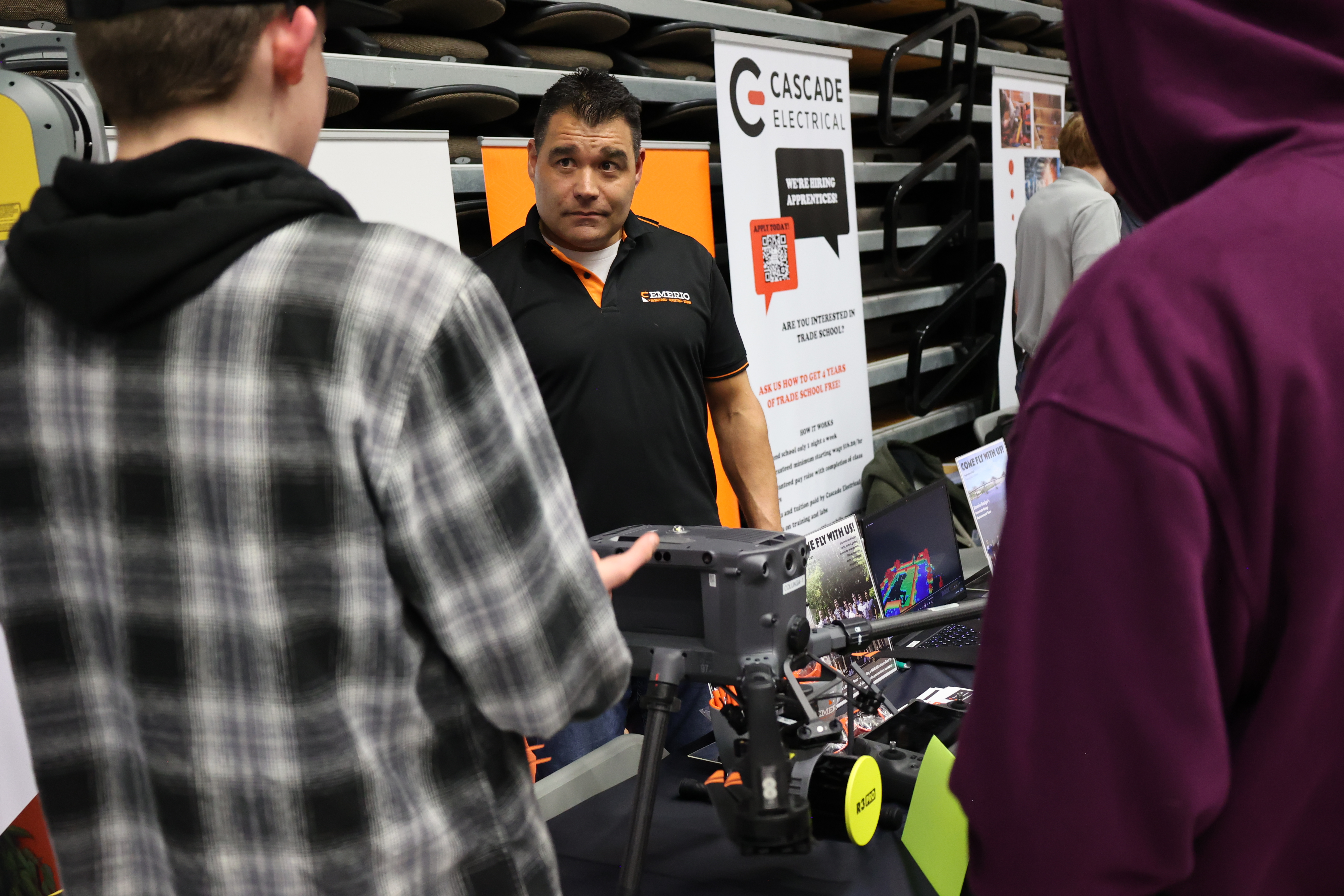 Cascade Electric rep speaks with attendees at 2024 Industry Fair