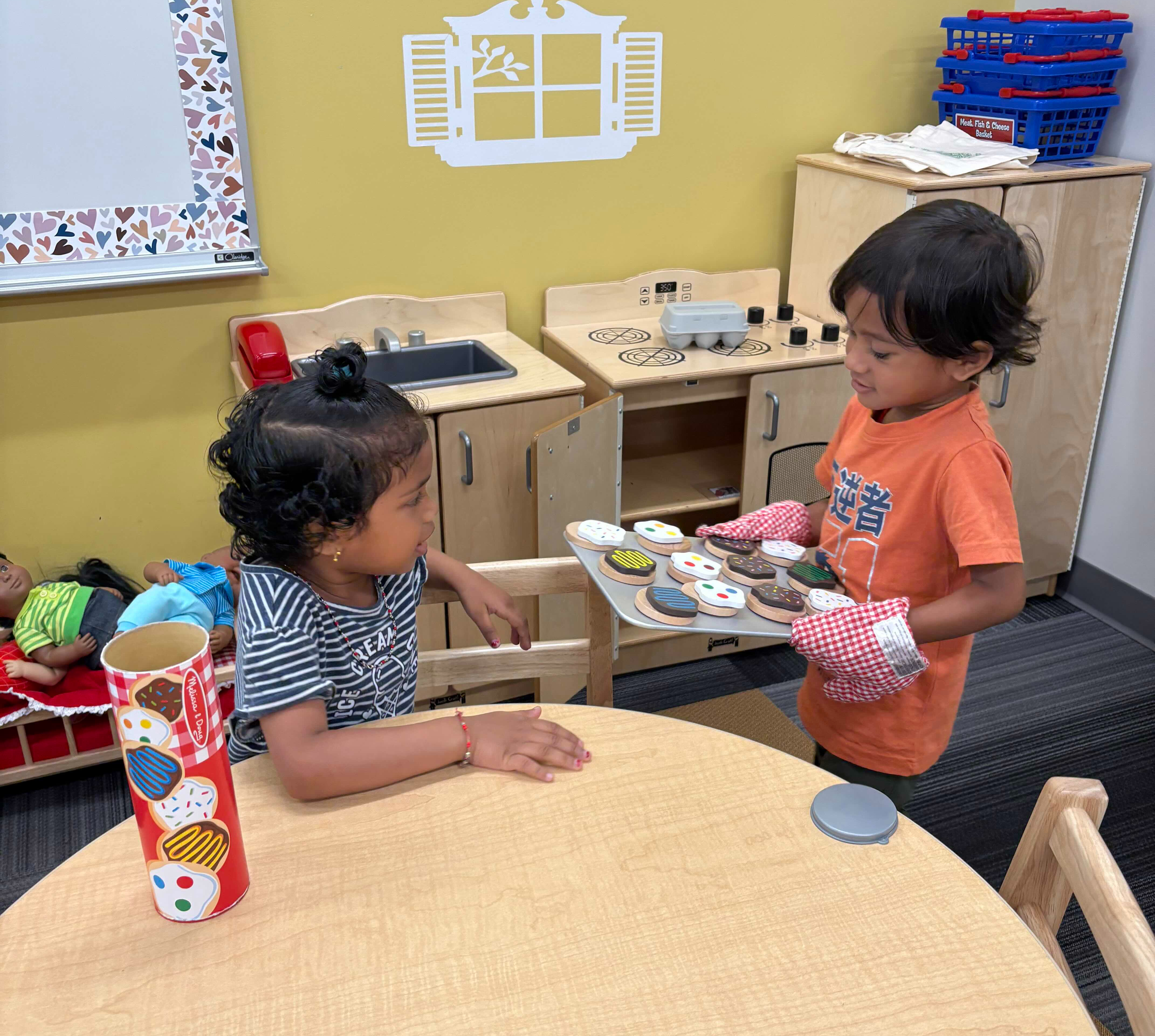 Children playing with cooking toys