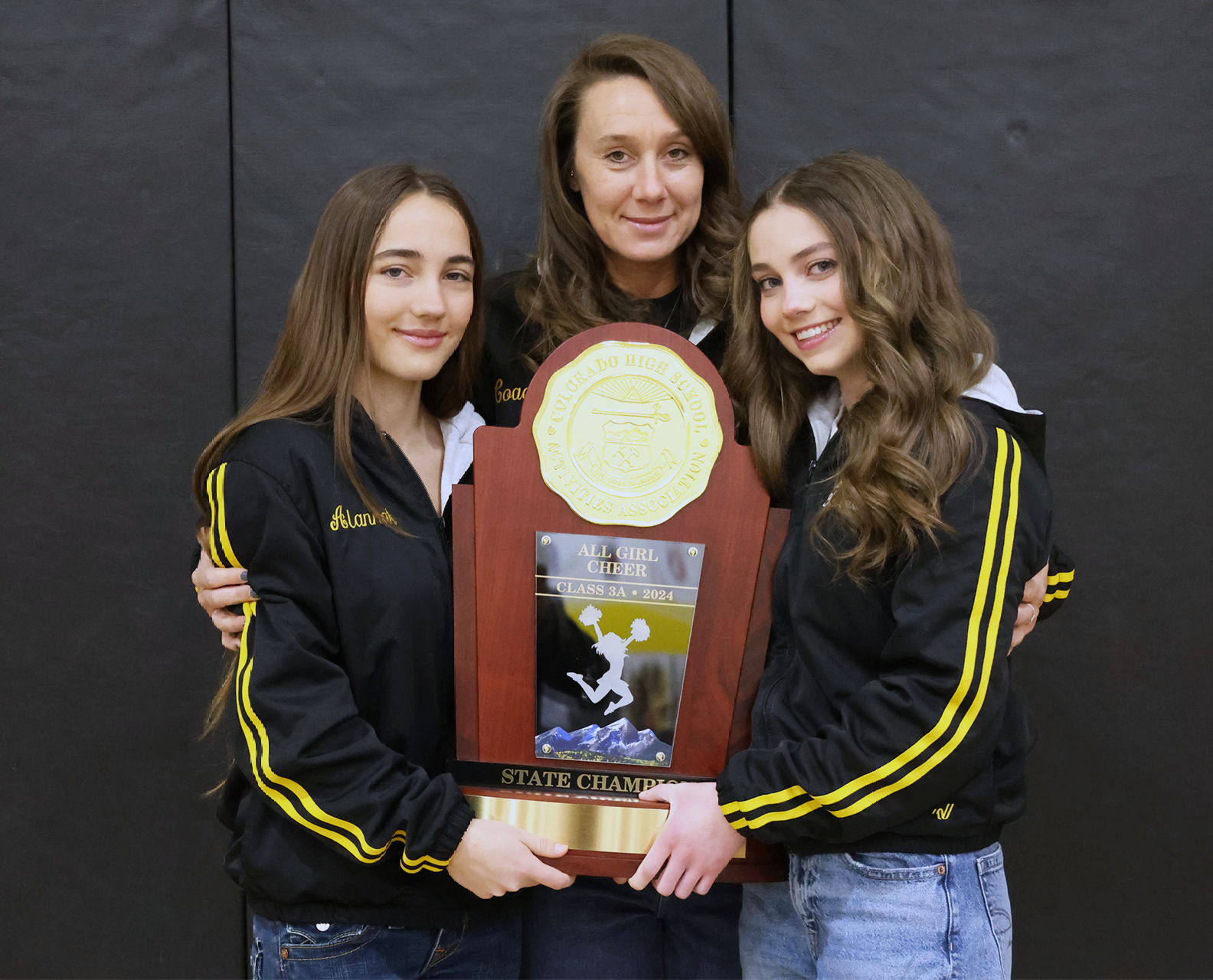 Alannah Gibney, Coach Nicolette Griffith and Kyla Eha from the PRA cheerleading team