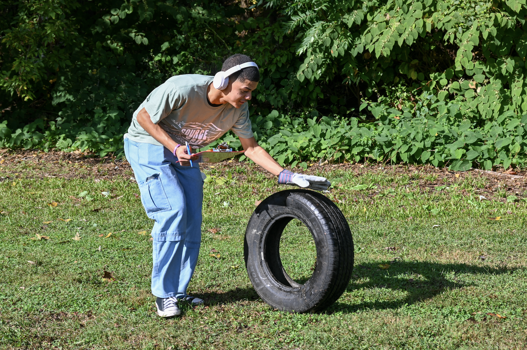 Student rolls tire out of the park