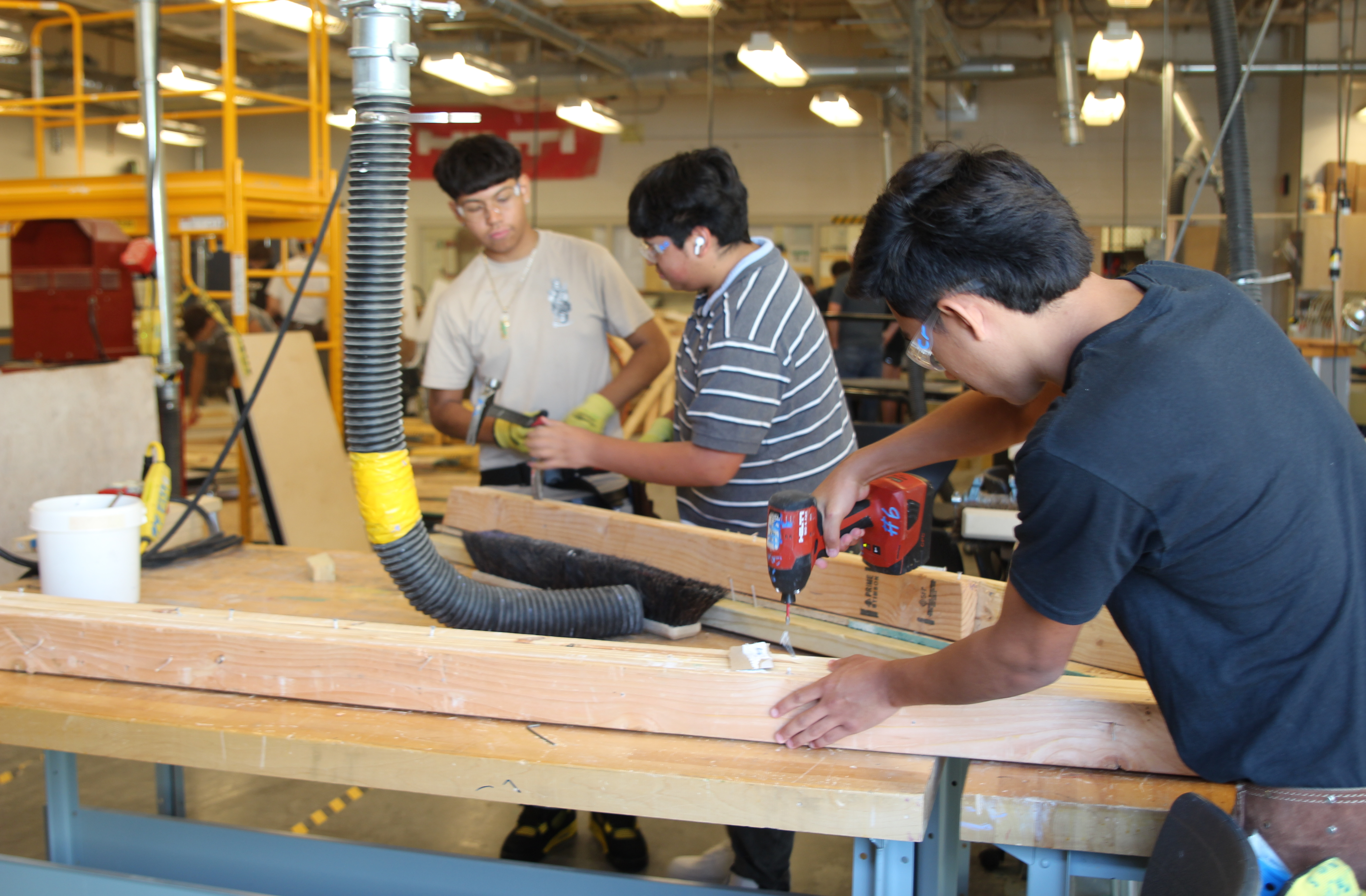 Students doing construction tasks
