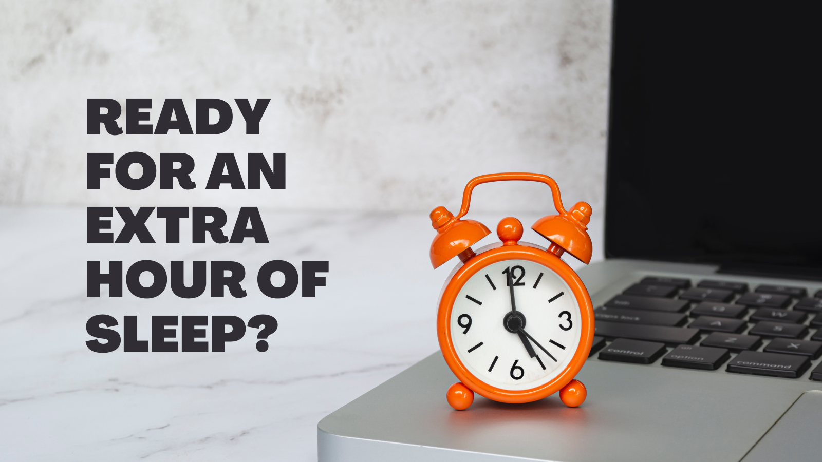 Orange clock on laptop with text: "Ready for an extra hour of sleep?"