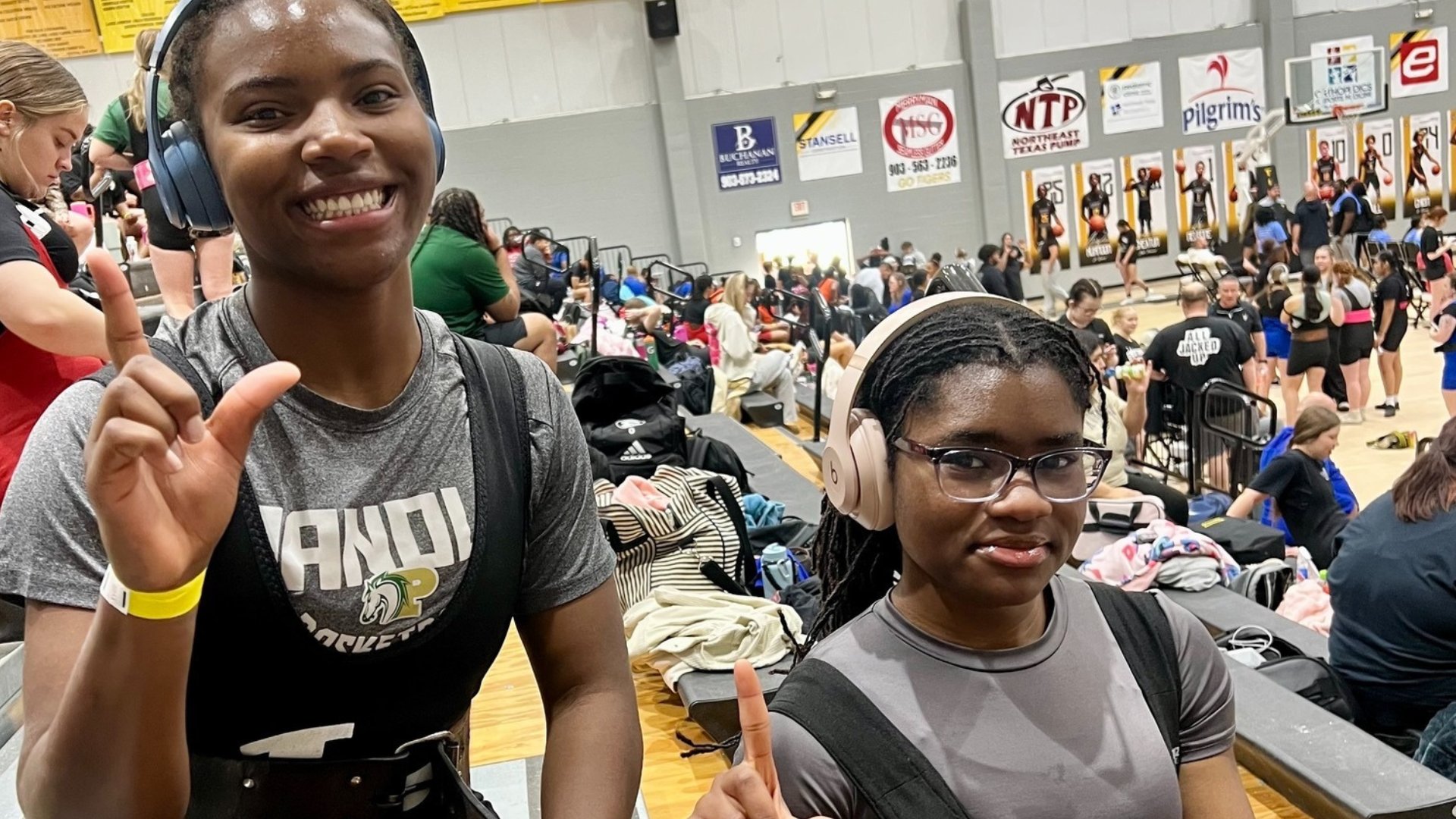 Lady Lobo powerlifting athletes, Kora Ottun and Jaharia Hunter, pose for a photo.
