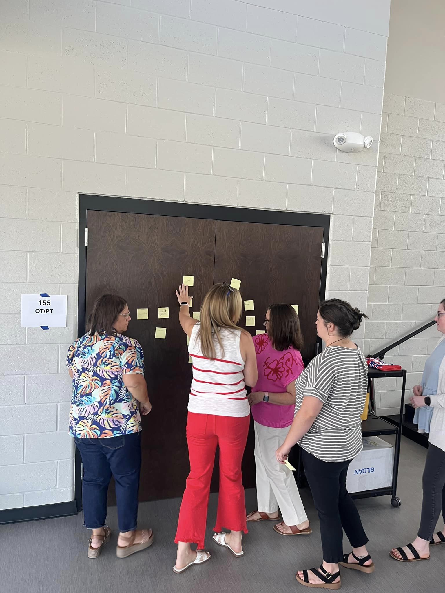 football player and duck greeting students