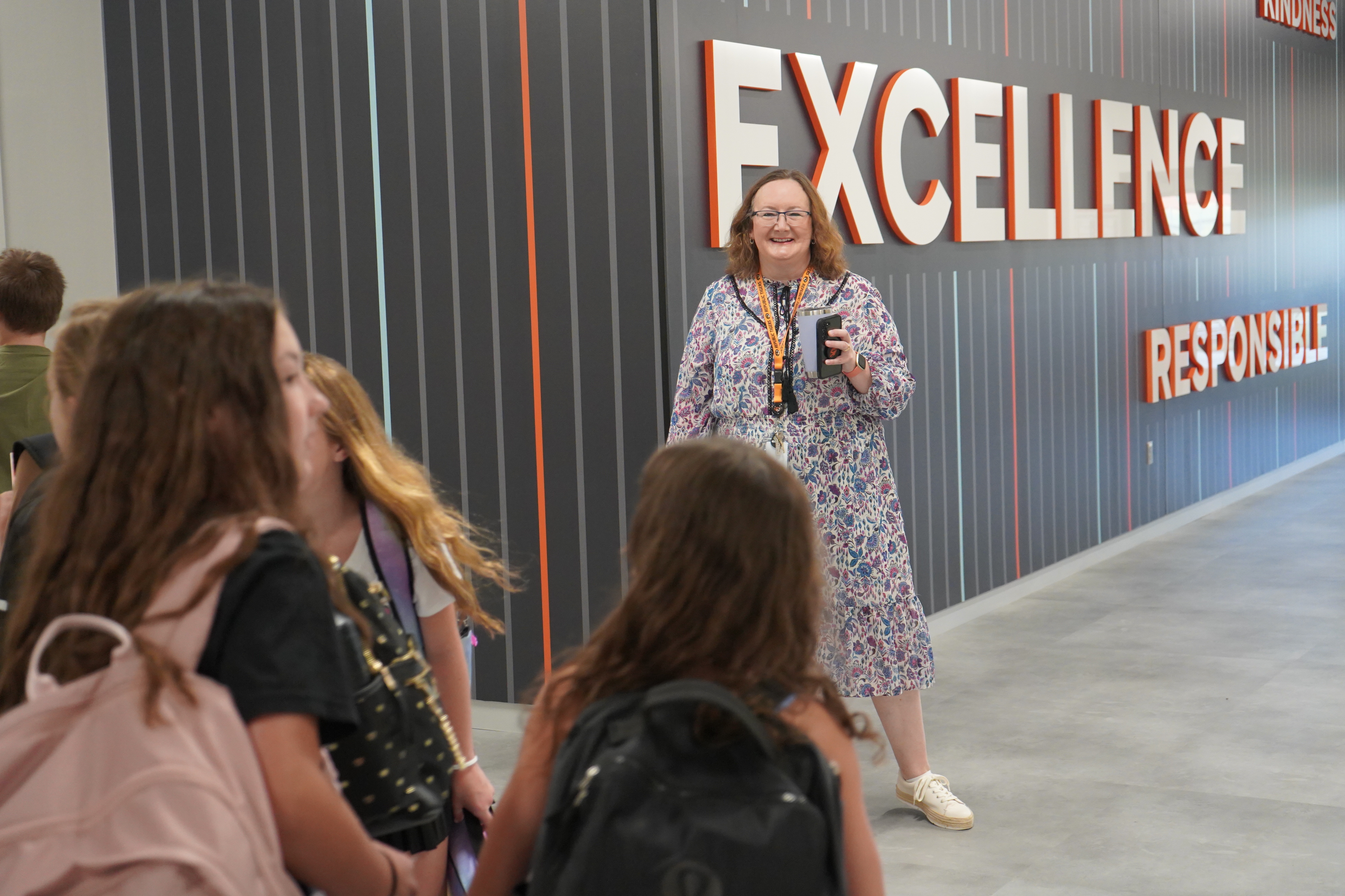 Teacher smiling at students