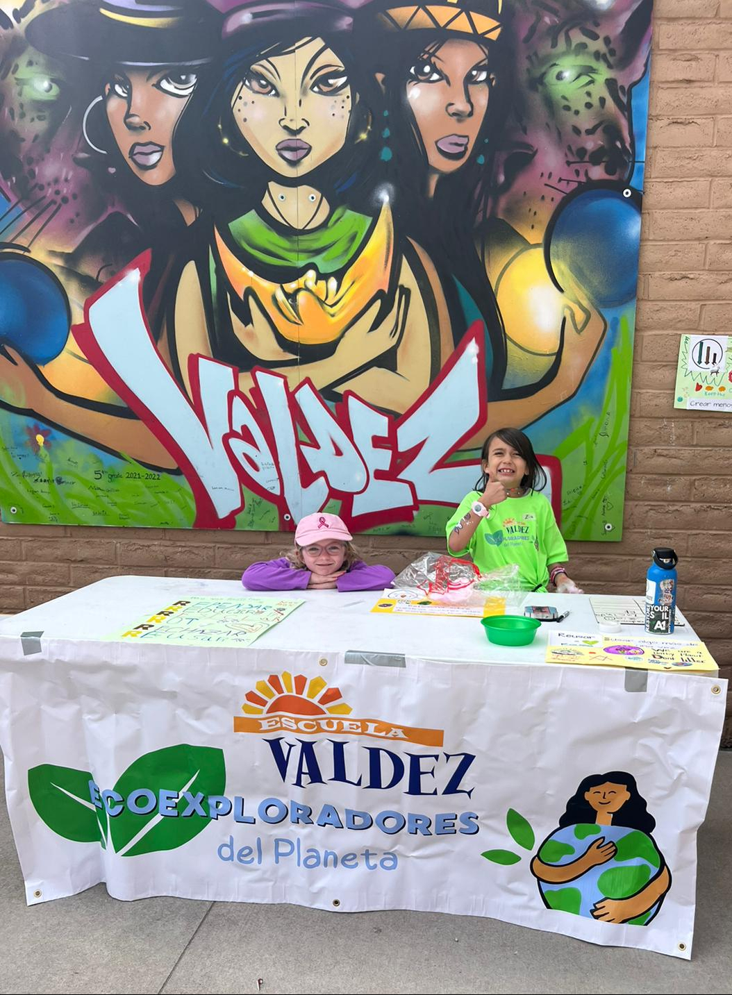 two young students tabling as part of Ecoexploradores