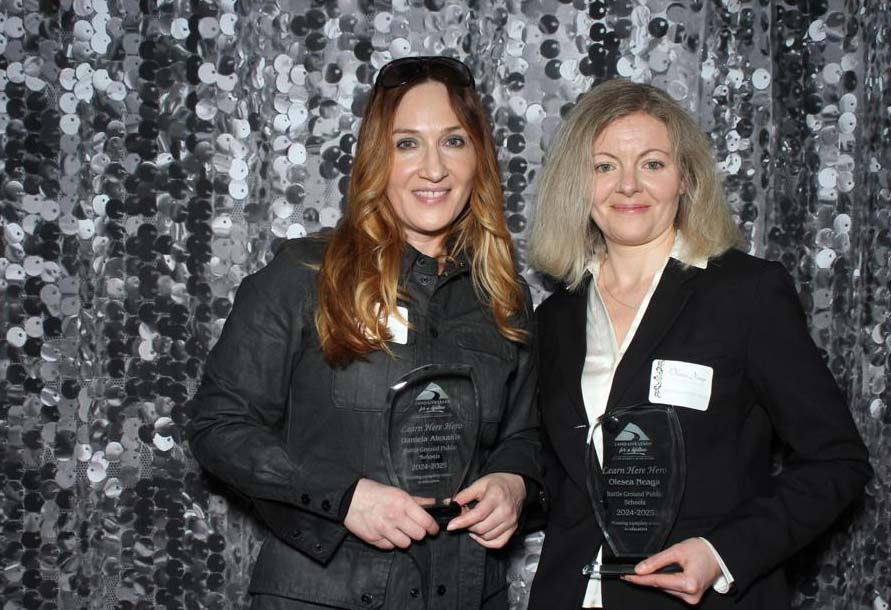 Olesea Neaga and Daniela Alexakis pose with their Identity Clark County Learn Here Real Hero awards