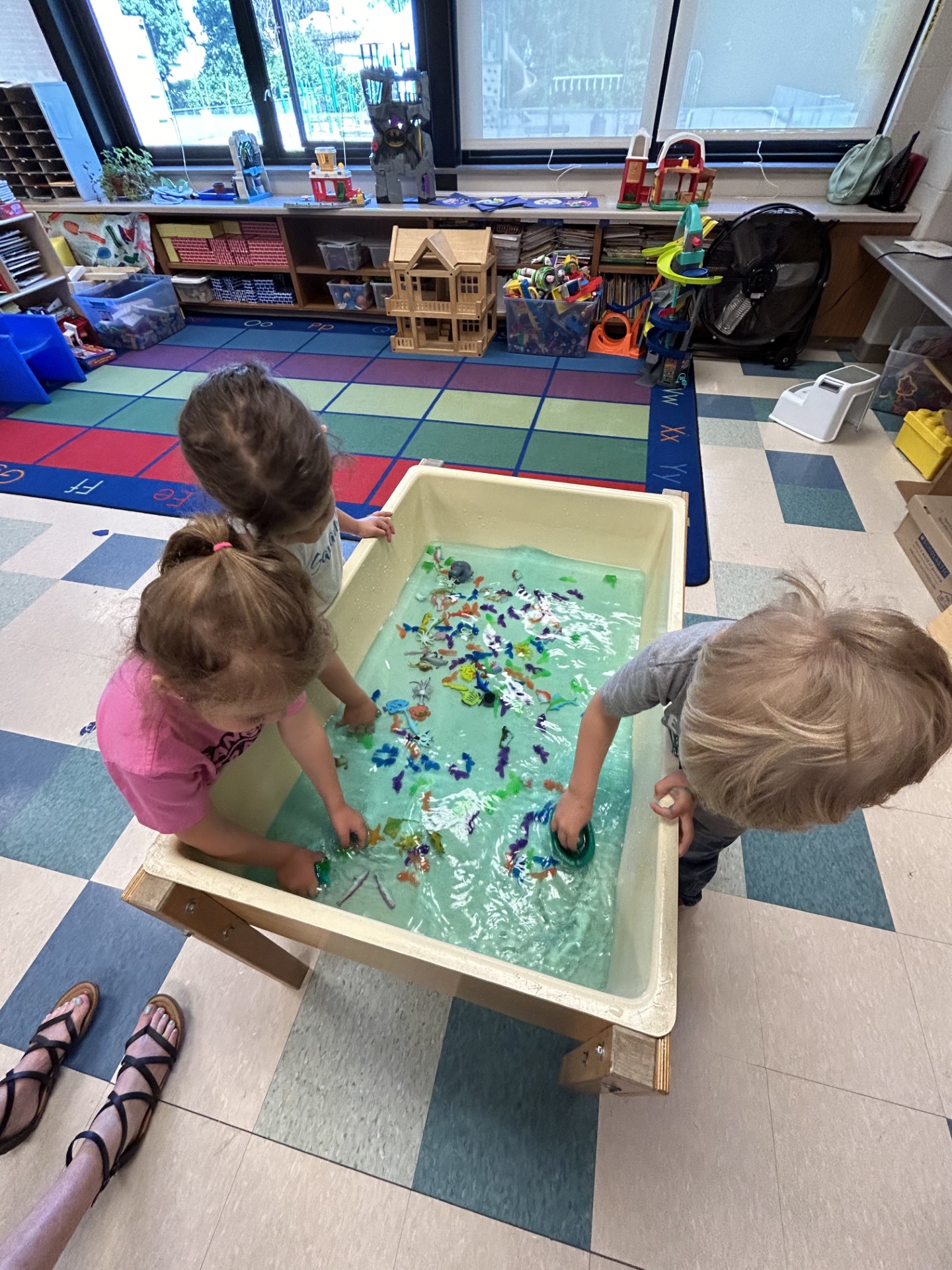 Students playing in water table