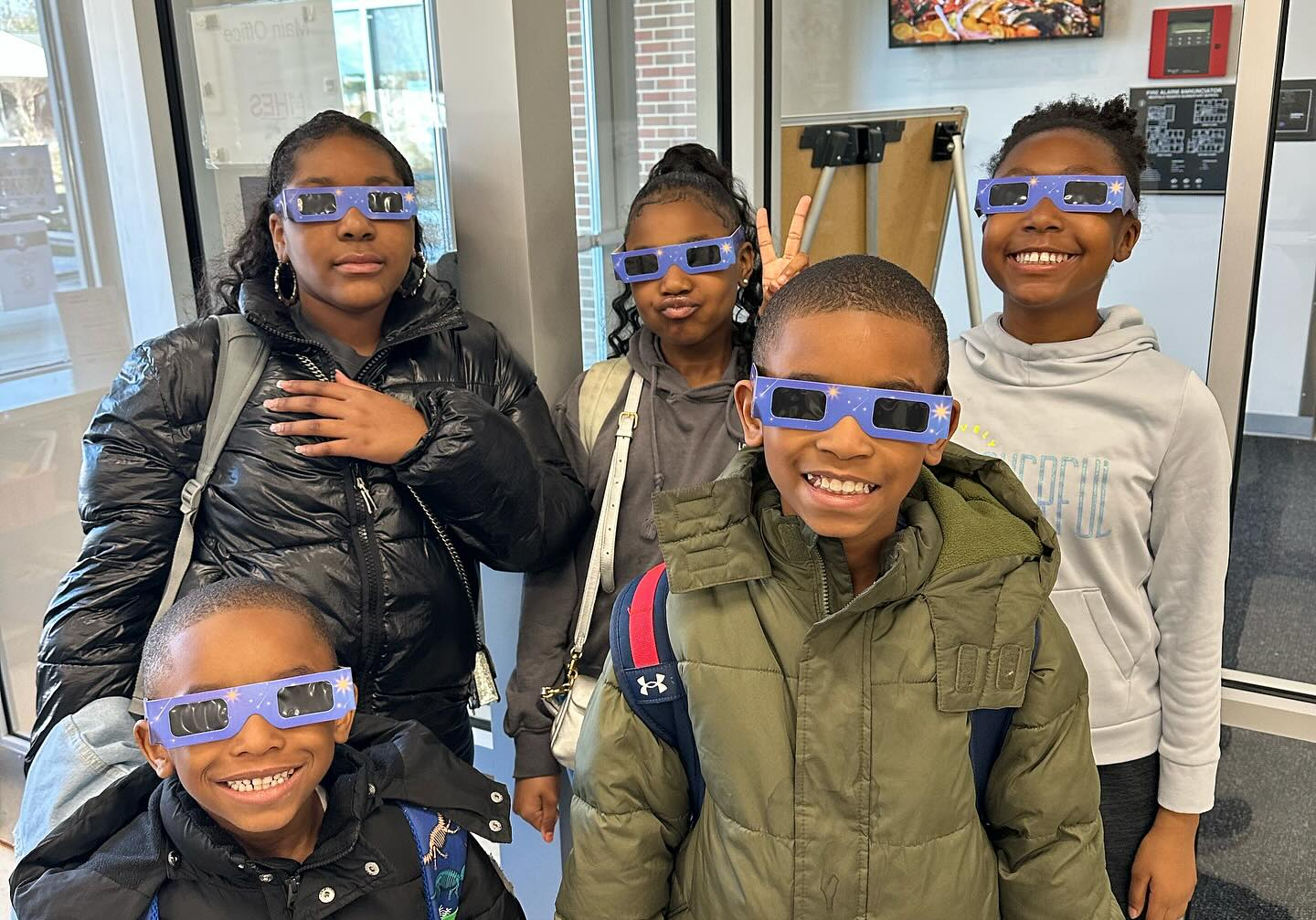 students with eclipse glasses