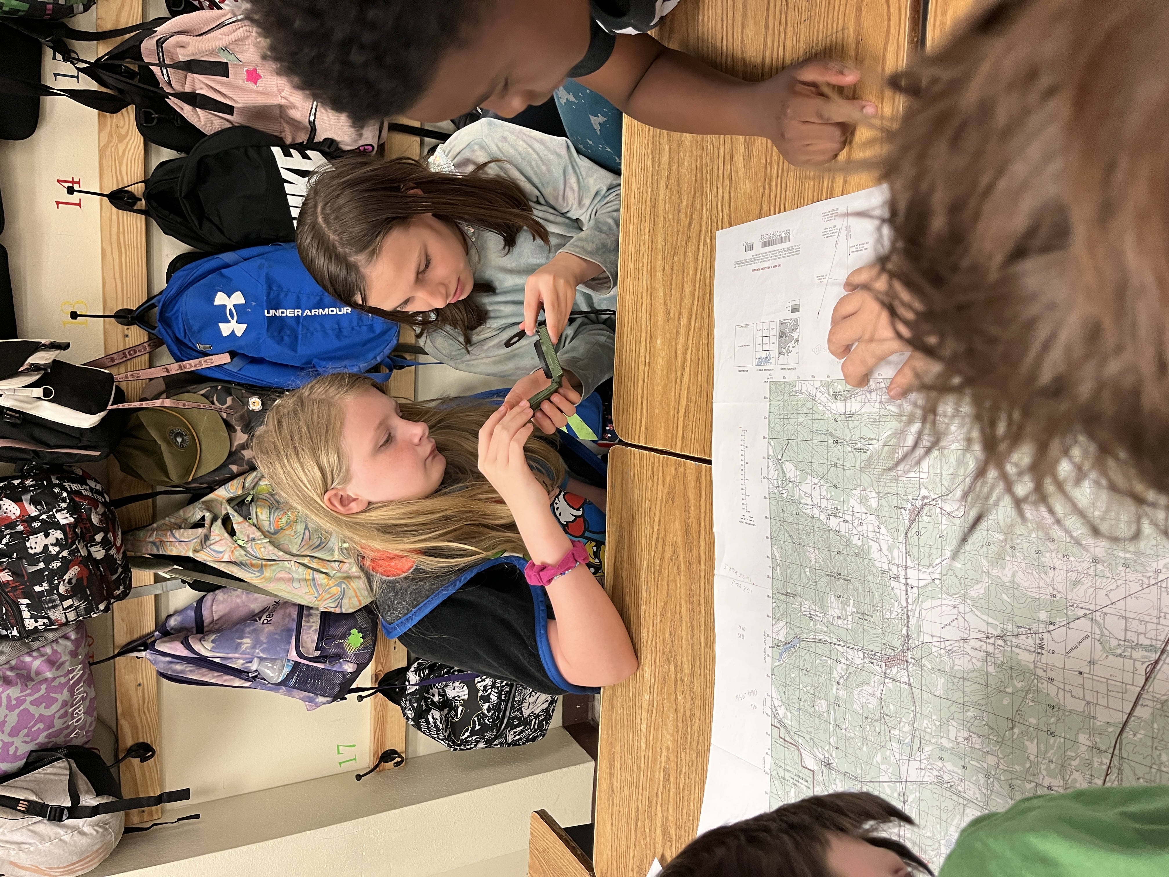 students looking at map