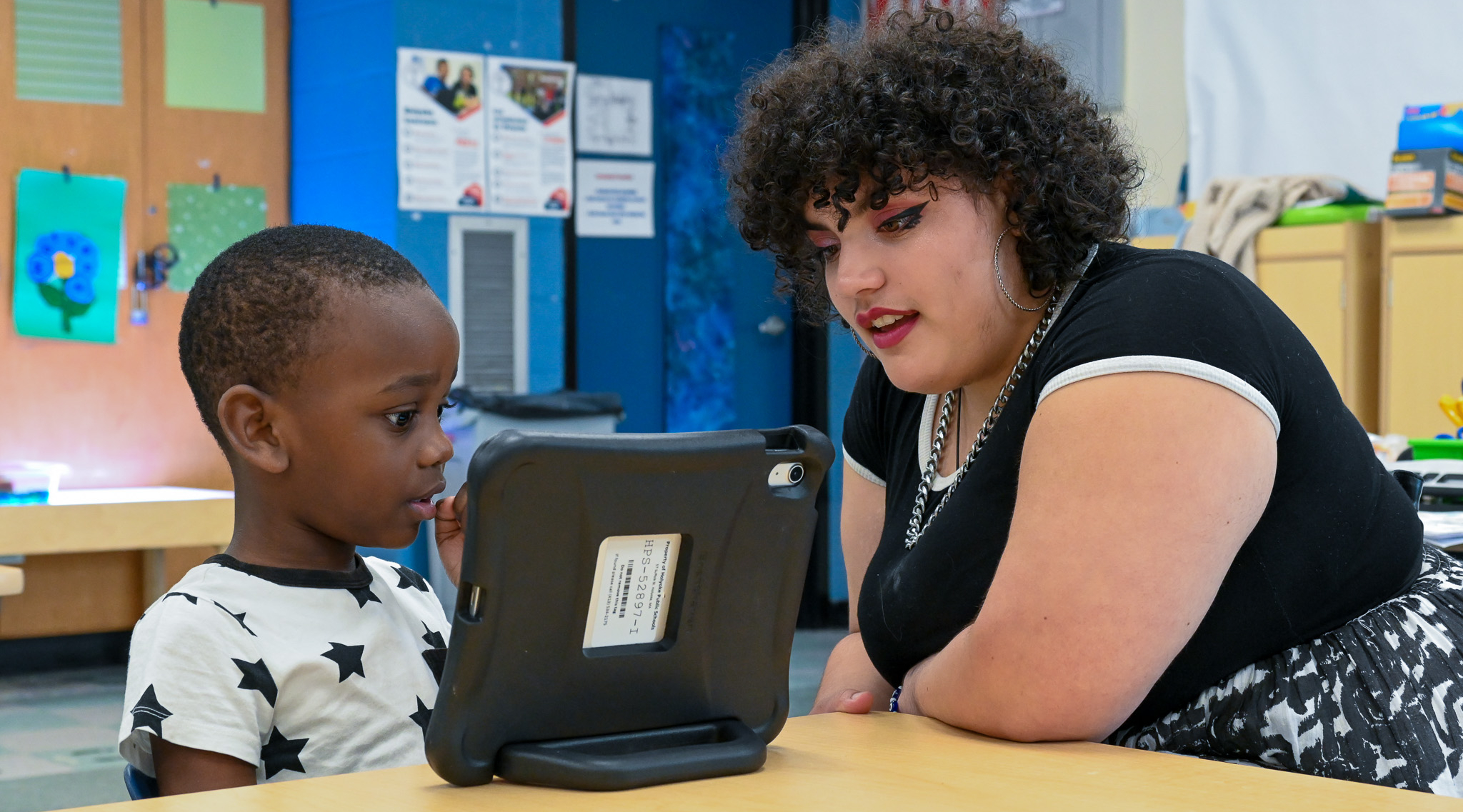 An instructor works with a student