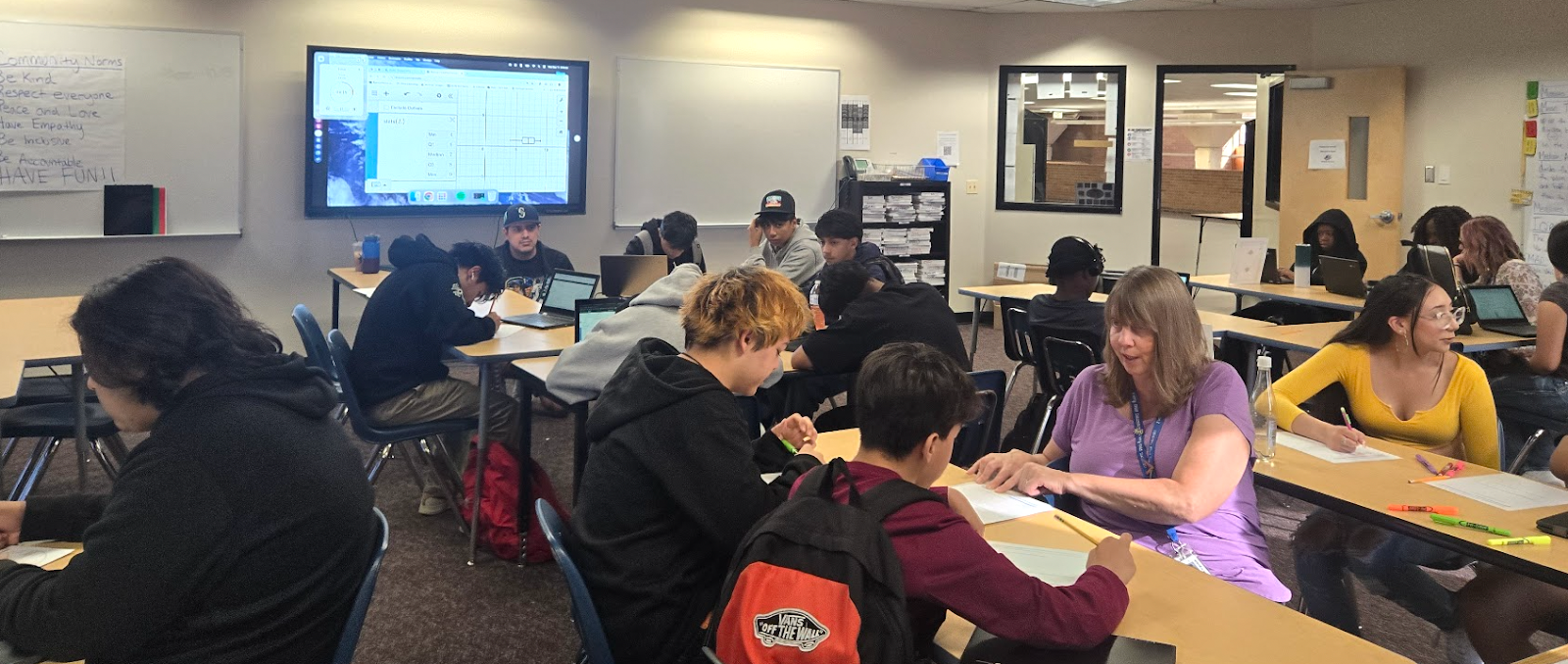 students working at their desks in a classroom