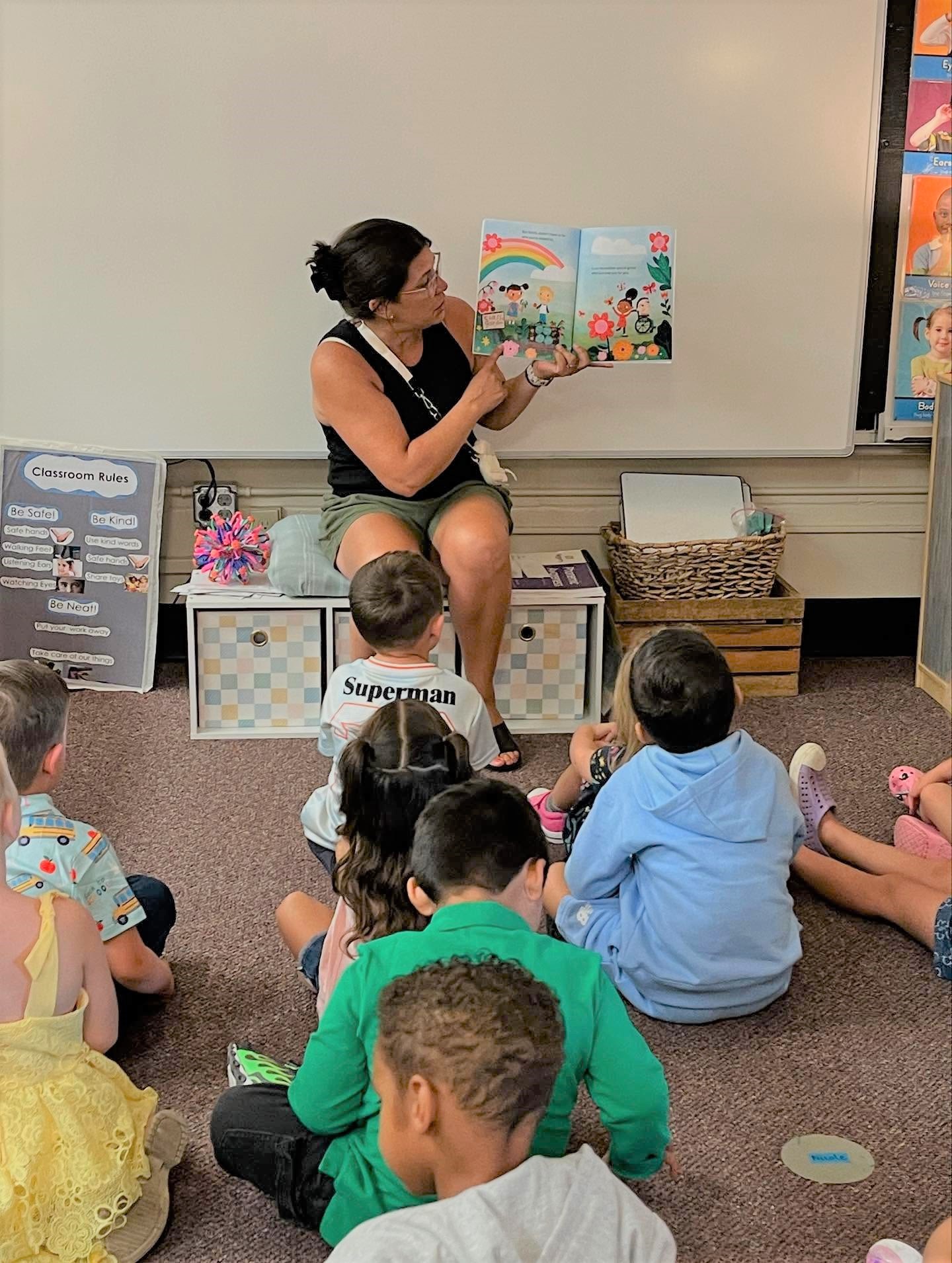 Teacher reading a story to students